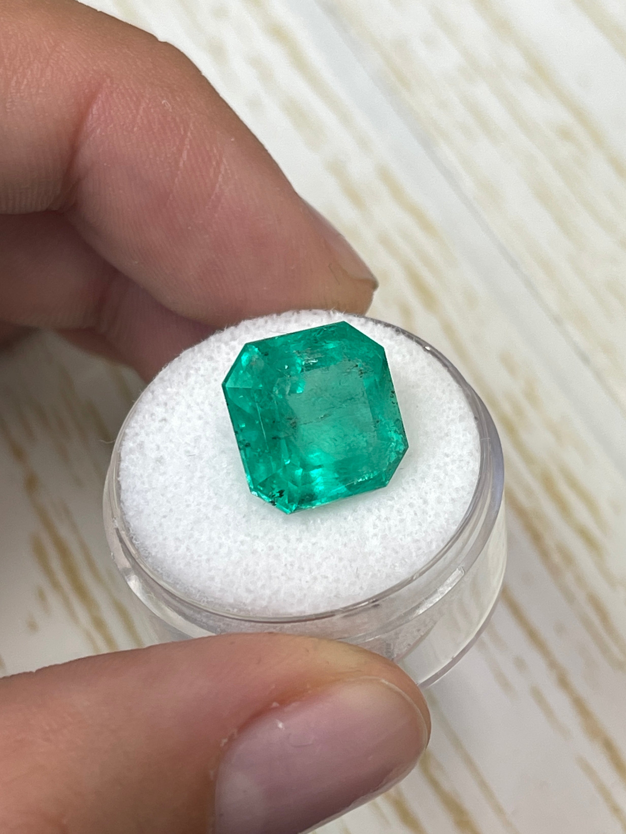 Huge 9.03 carat green Colombian emerald loose gemstone in Asscher cut, natural and vibrant, from JR Colombian Emeralds.