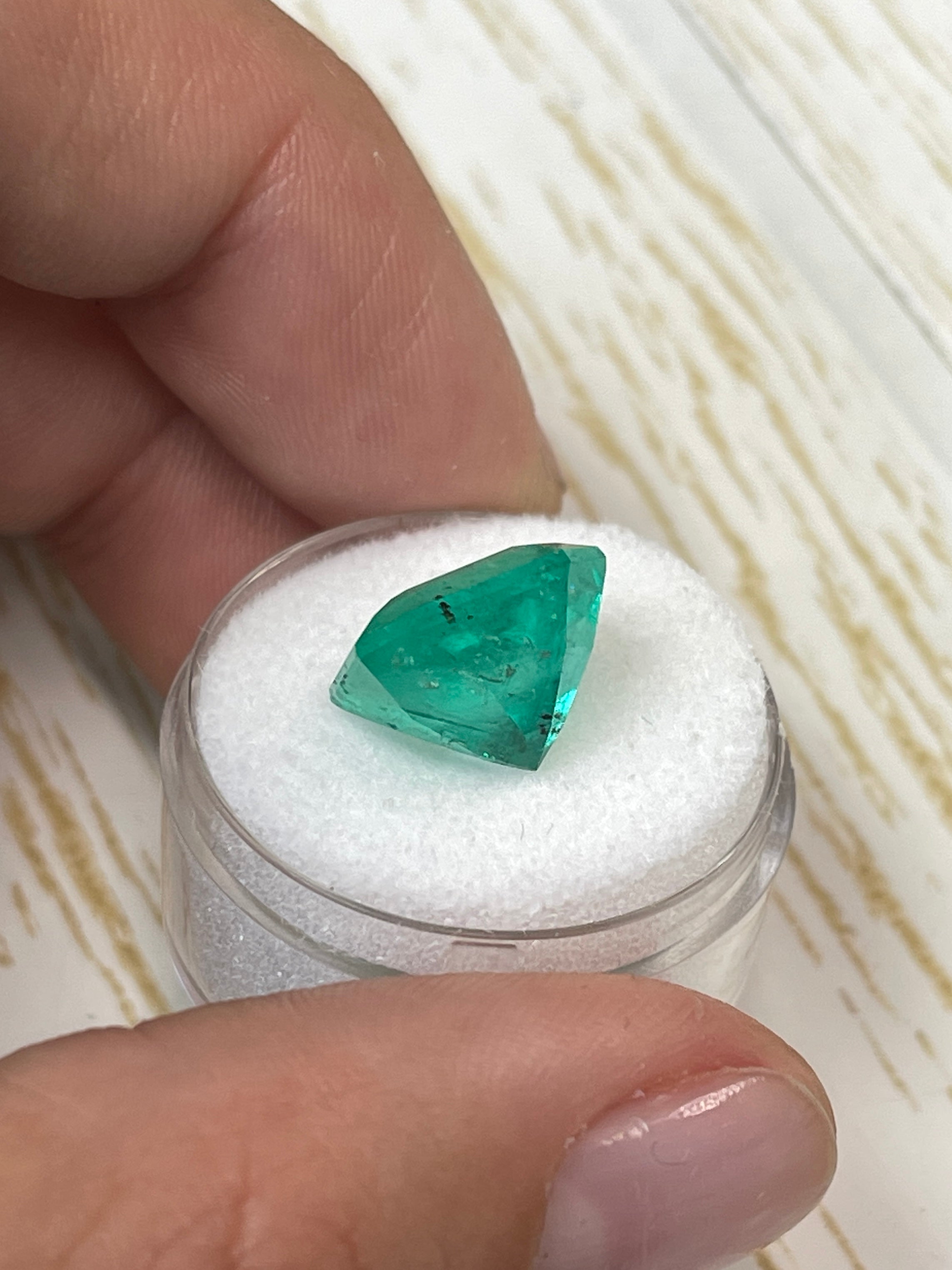 Large 9.03 carat natural Colombian emerald loose gemstone in Asscher cut, vibrant green color, from JR Colombian Emeralds.