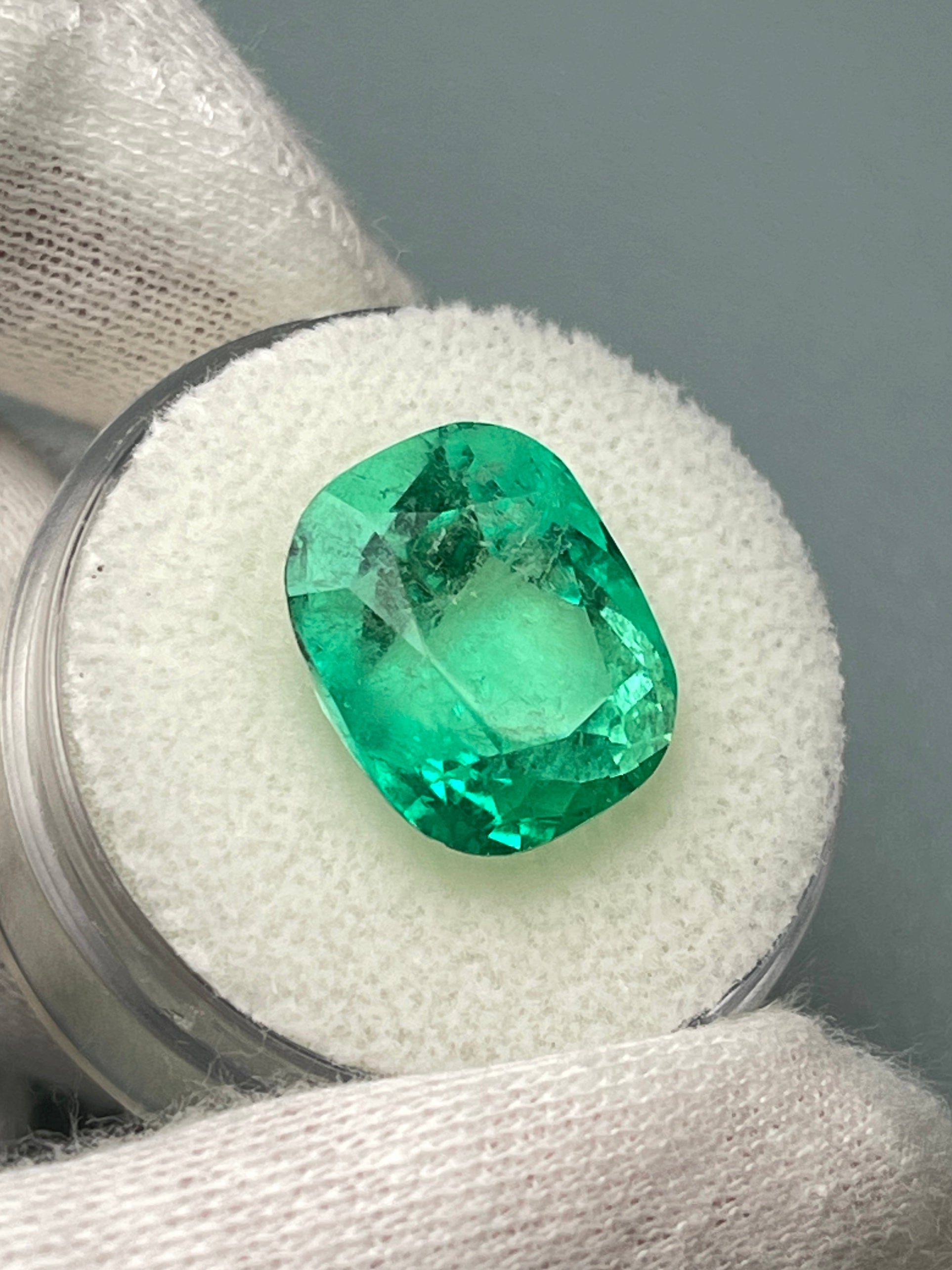 9.23 carat Muzo yellowish green Colombian emerald loose cushion cut gemstone from JR Colombian Emeralds.