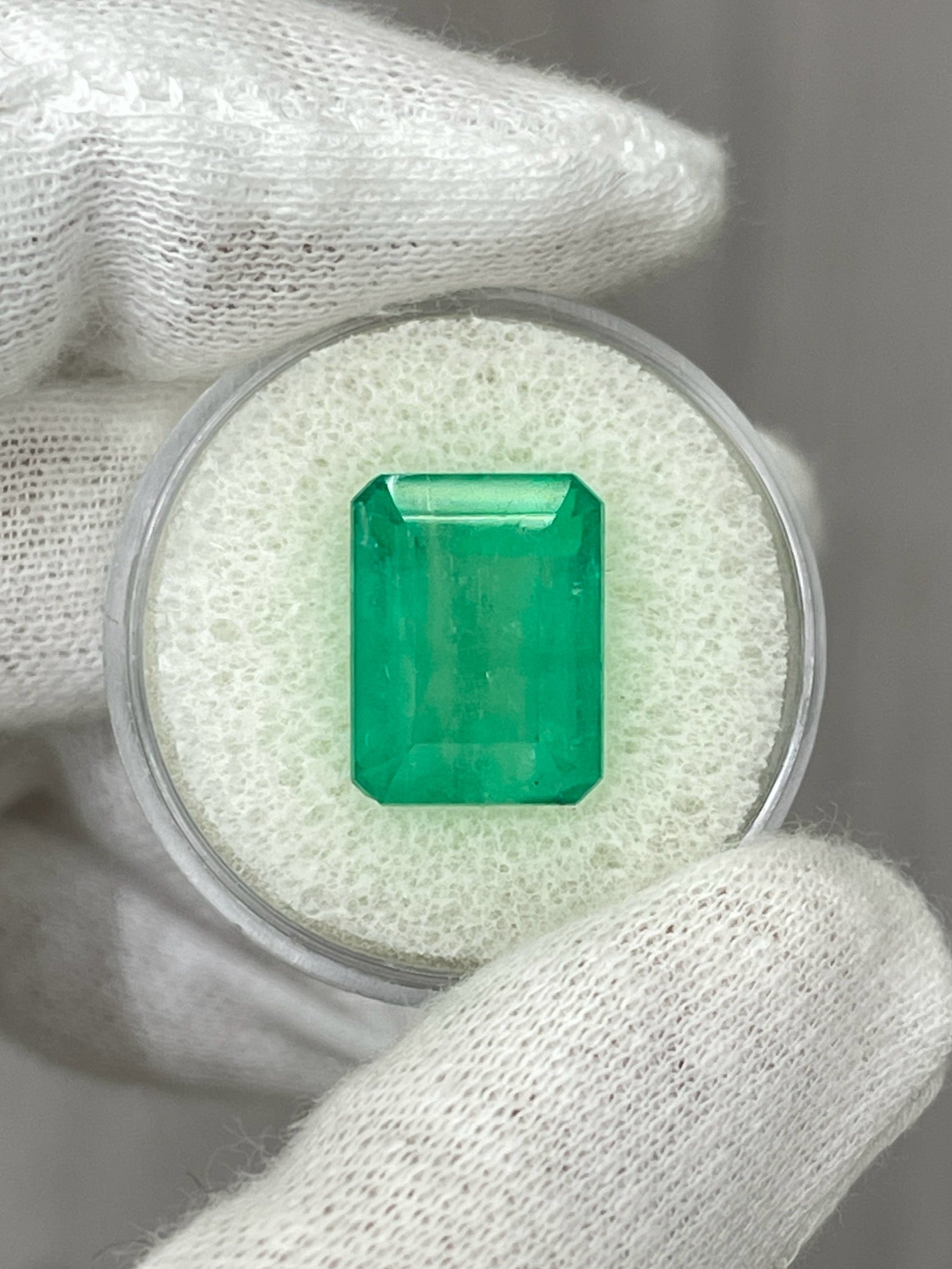 Medium green 13x10 emerald cut Colombian emerald gemstone, loose and earthy, from JR Colombian Emeralds.