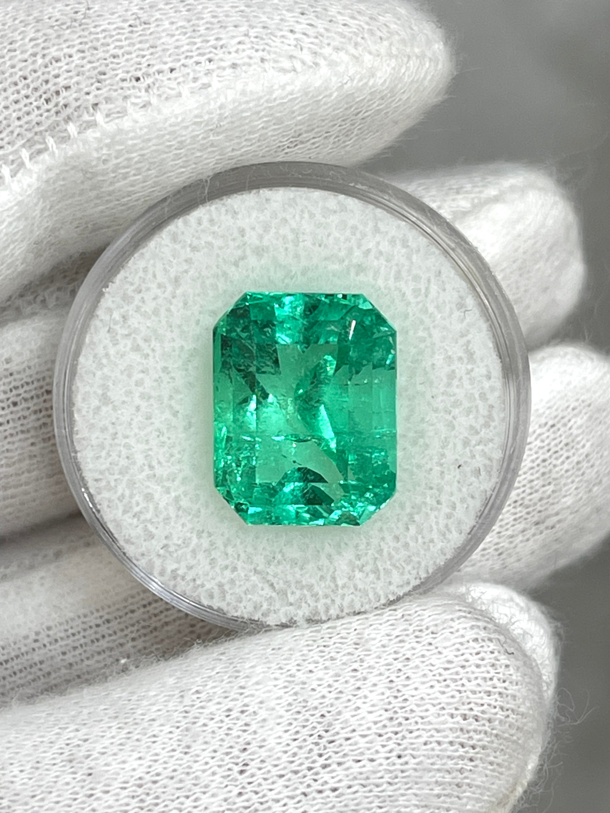 9.51 carat vivacious green Colombian emerald cut loose gemstone from JR Colombian Emeralds showing vibrant color and clarity.
