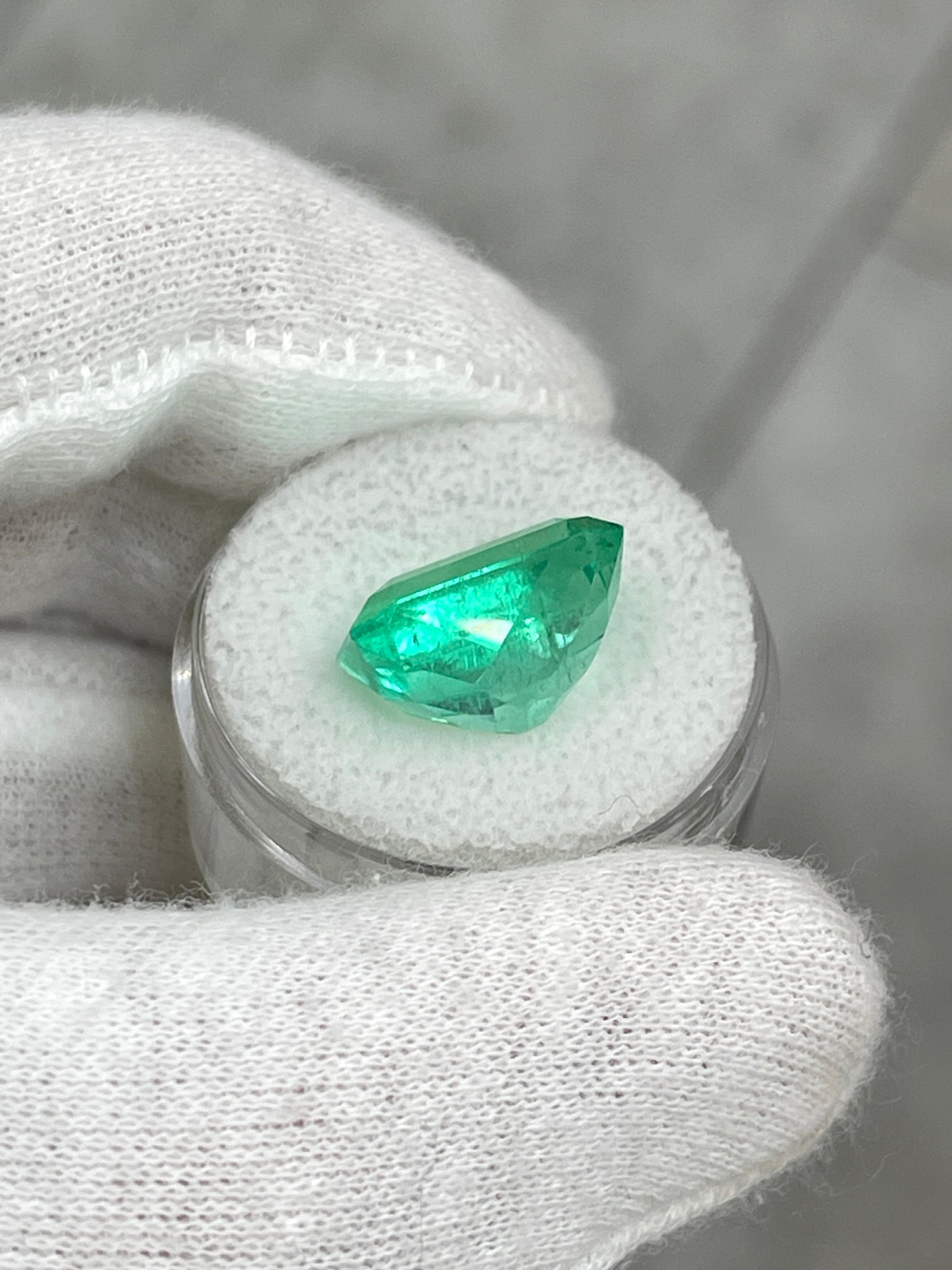 9.51 carat vibrant green Colombian emerald cut loose gemstone from JR Colombian Emeralds, showcasing clarity and rich color.
