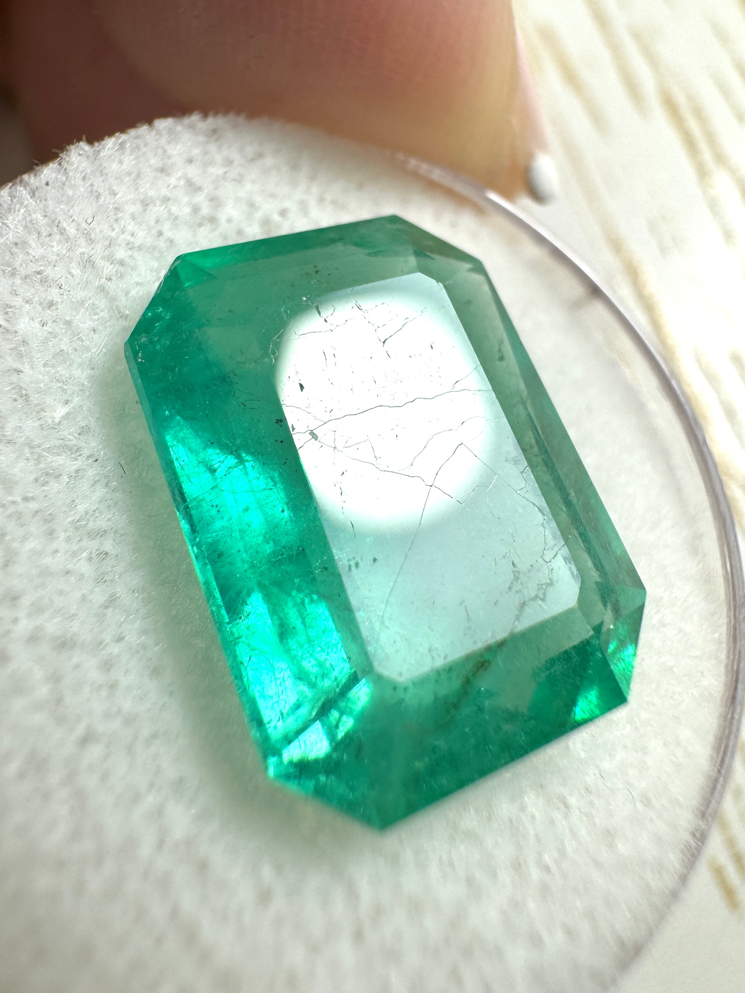 Large 9.52-carat natural Colombian emerald loose gemstone in an emerald cut, showcasing vibrant green color and clarity.