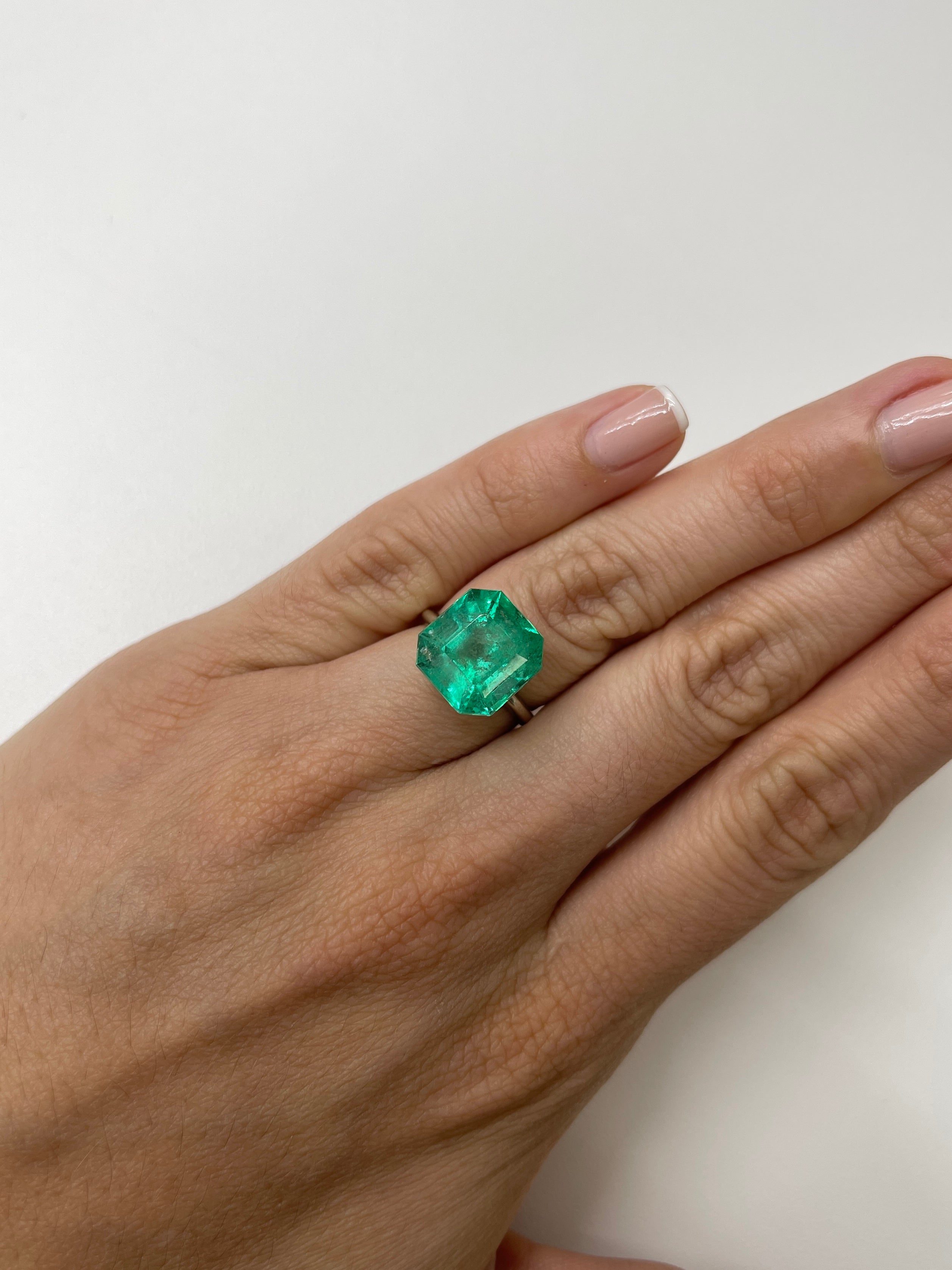Medium green 9.79 carat Colombian emerald in classic Asscher cut, natural loose gemstone from JR Colombian Emeralds.