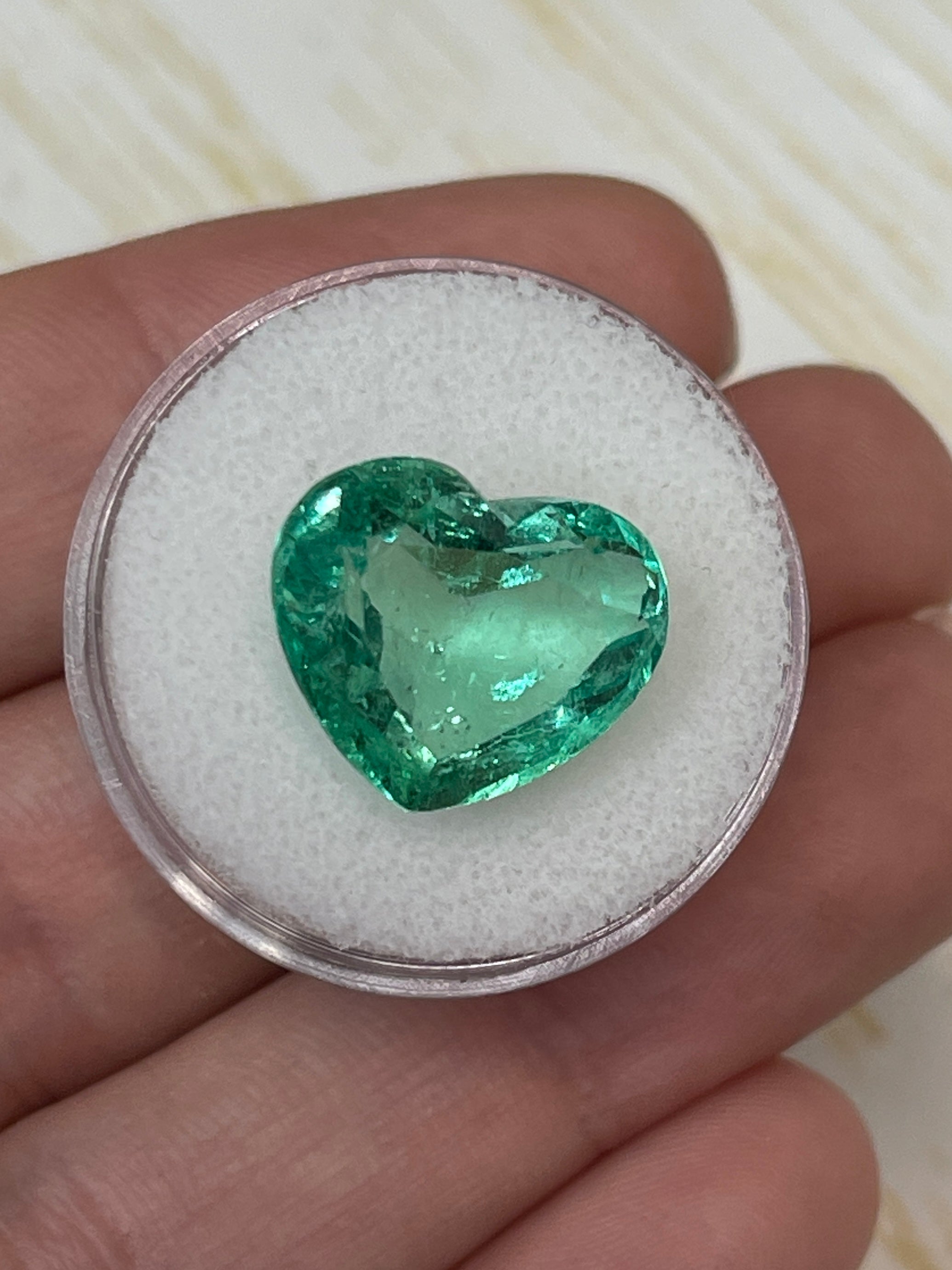 Natural loose Colombian emerald heart cut, 9.84 carats, eye clean, bubbly appearance, from JR Colombian Emeralds.