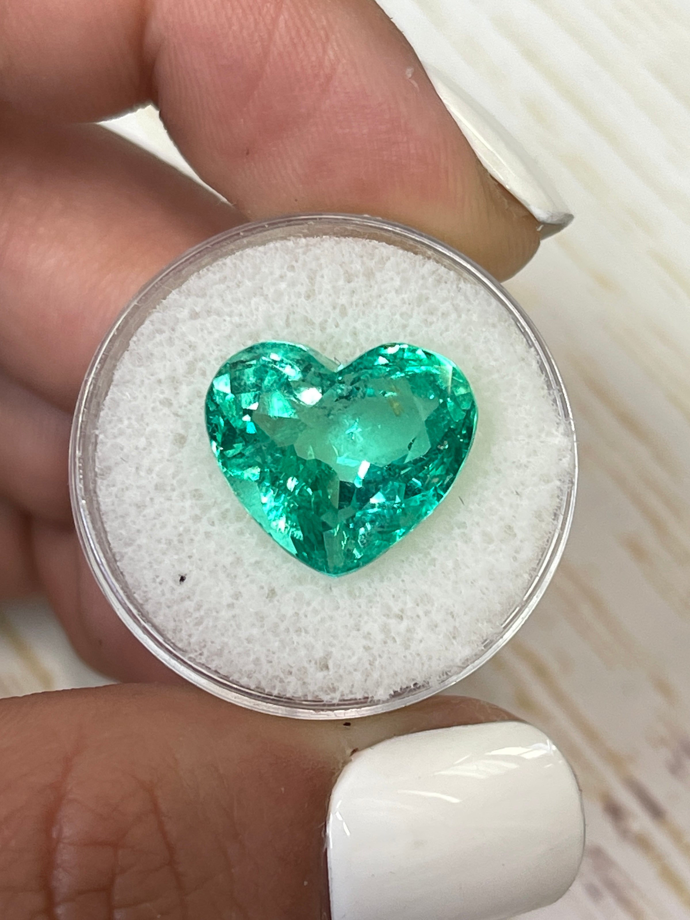 9.86 carat yellowish green natural Colombian emerald heart cut loose gemstone from JR Colombian Emeralds