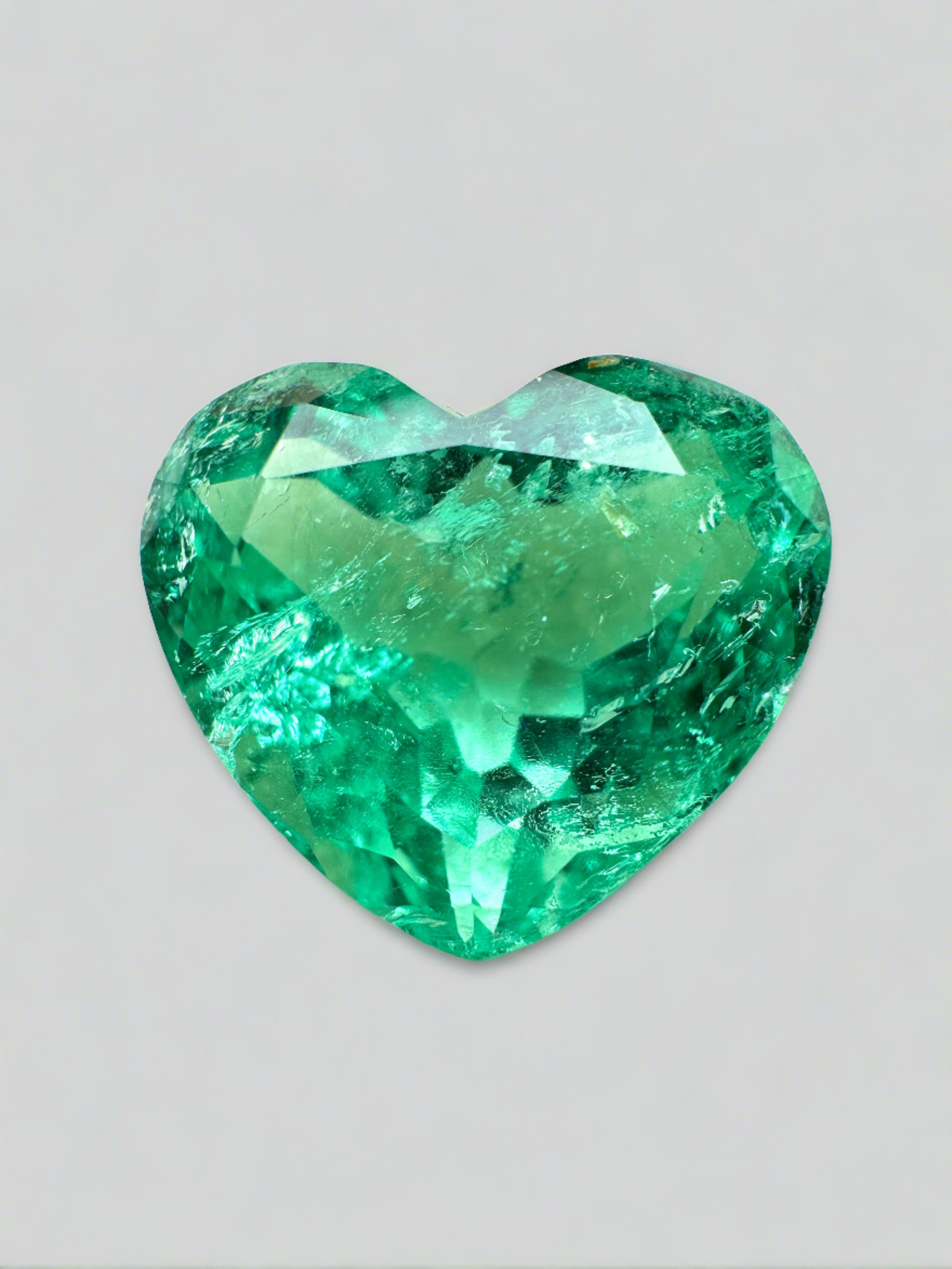 9.86 carat yellowish-green natural Colombian emerald in heart cut, loose gemstone showcasing vibrant color and clarity.