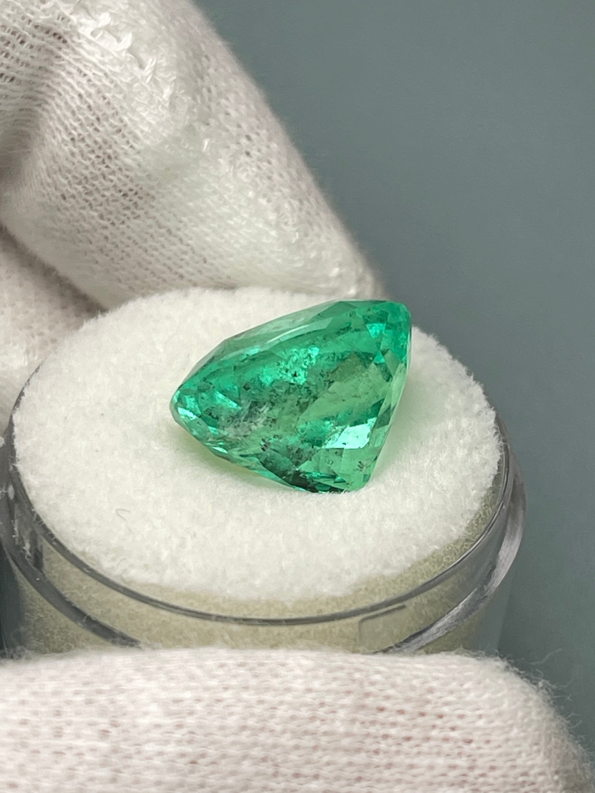 Loose 9.89 carat Colombian emerald in cushion cut, vibrant spring green color, natural gemstone from JR Colombian Emeralds.