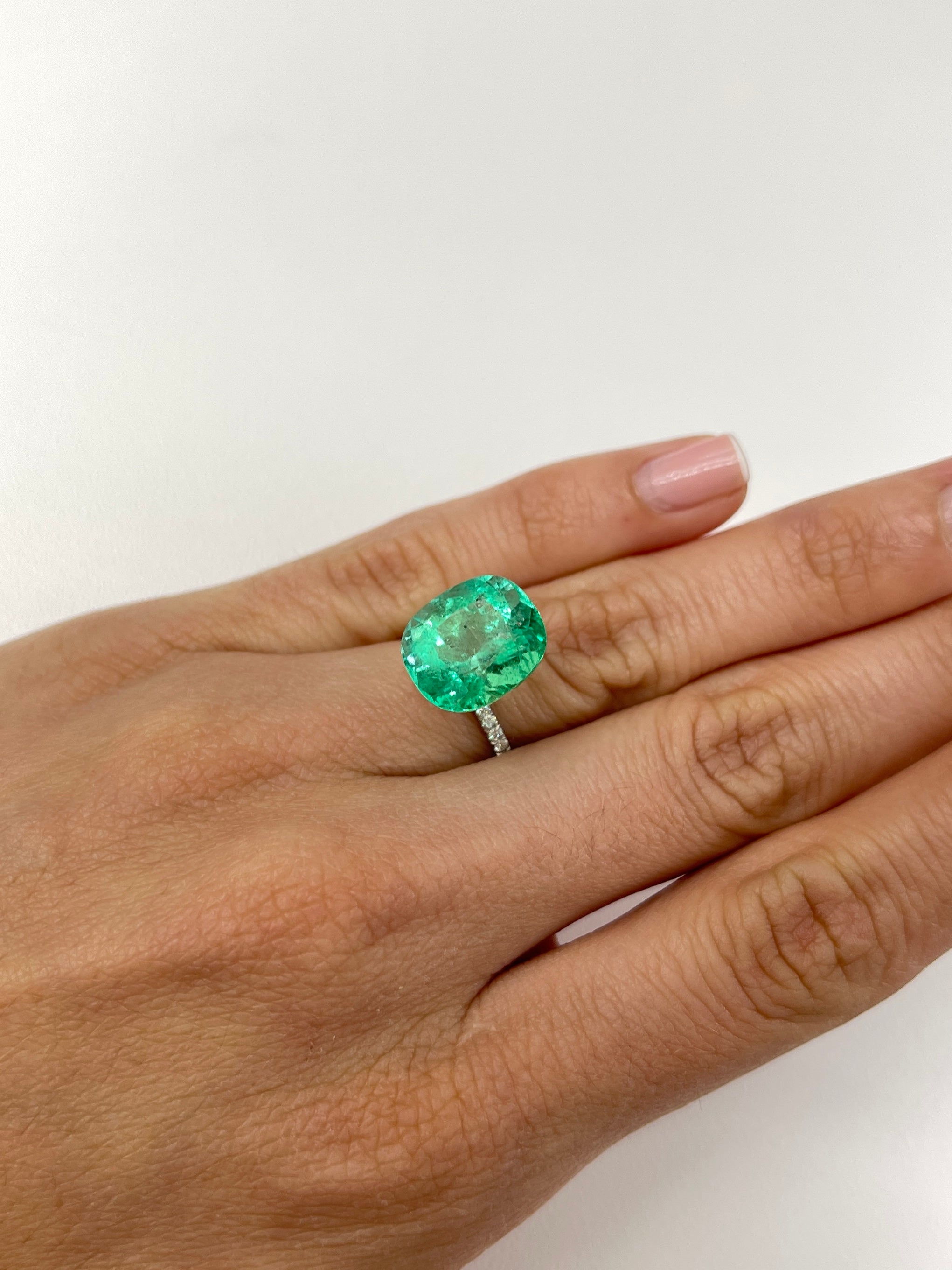 Loose 9.89 carat cushion cut Colombian emerald with spring green color, natural gemstone from JR Colombian Emeralds.