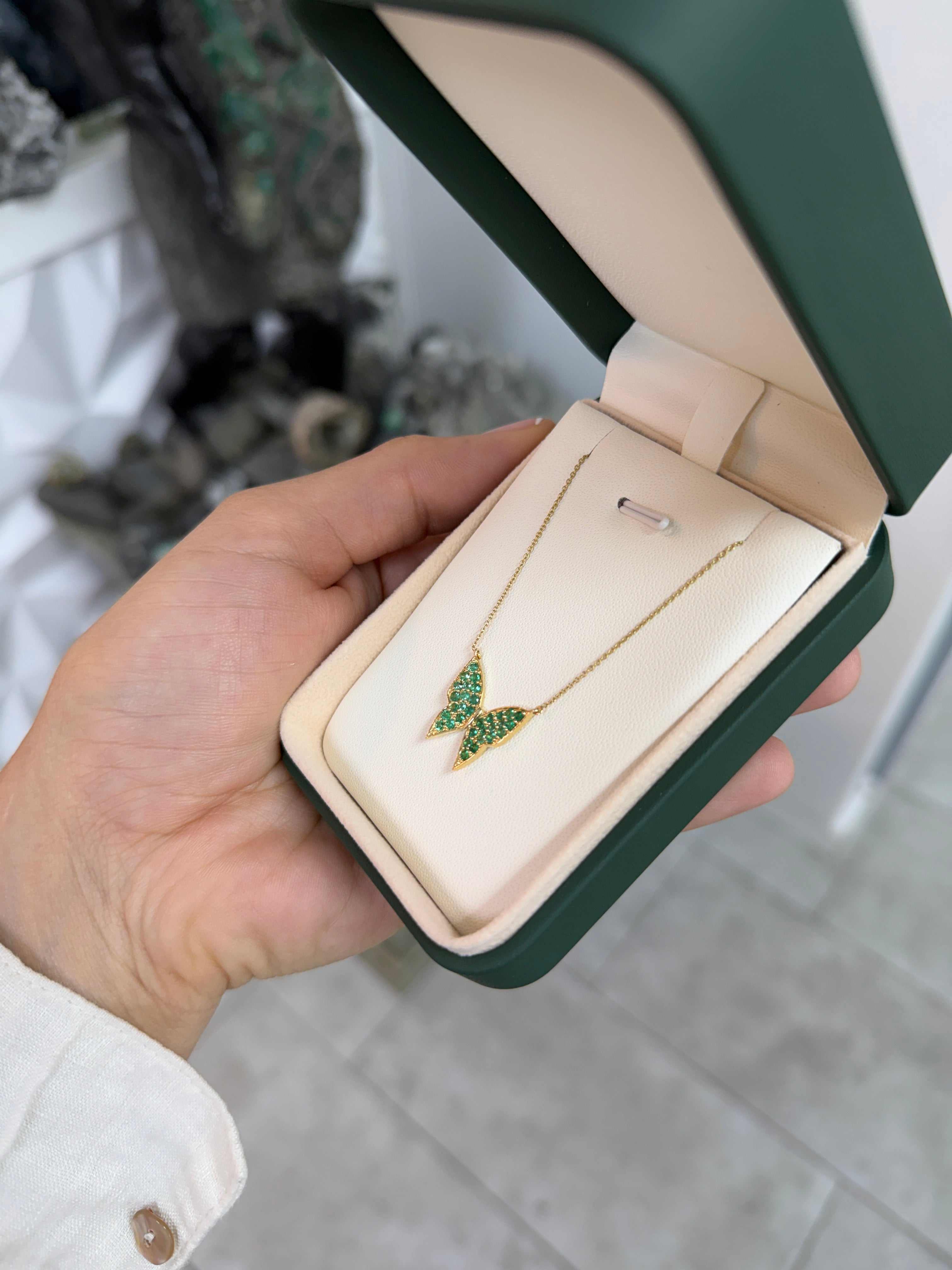 14K gold butterfly necklace with emerald pave accents, as seen on Instagram, showcasing JR Colombian Emeralds' elegant jewelry design.