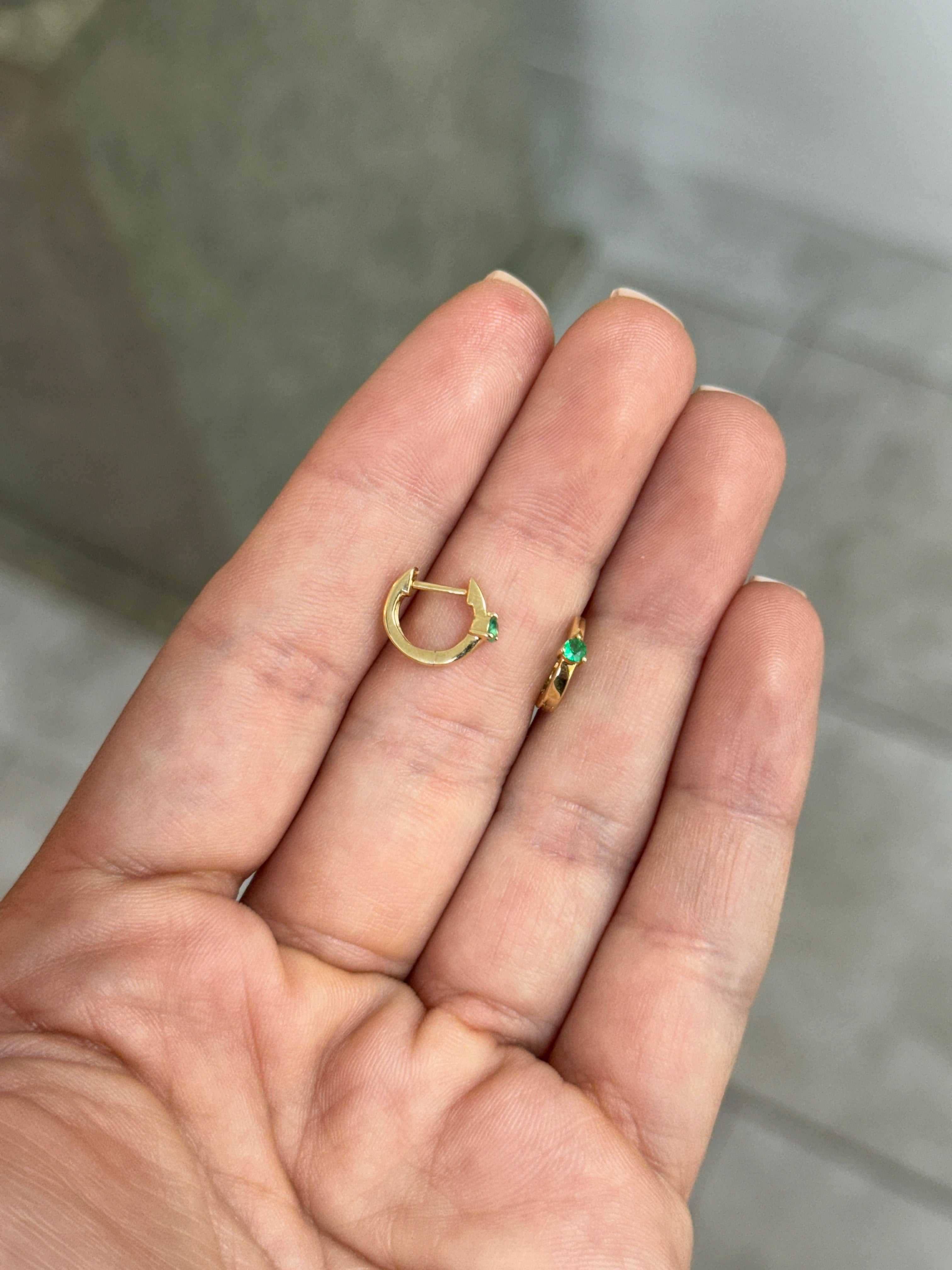 Emerald Huggie Earrings by JR Colombian Emeralds, 14K gold with three-prong setting, close-up of sparkling green gemstones