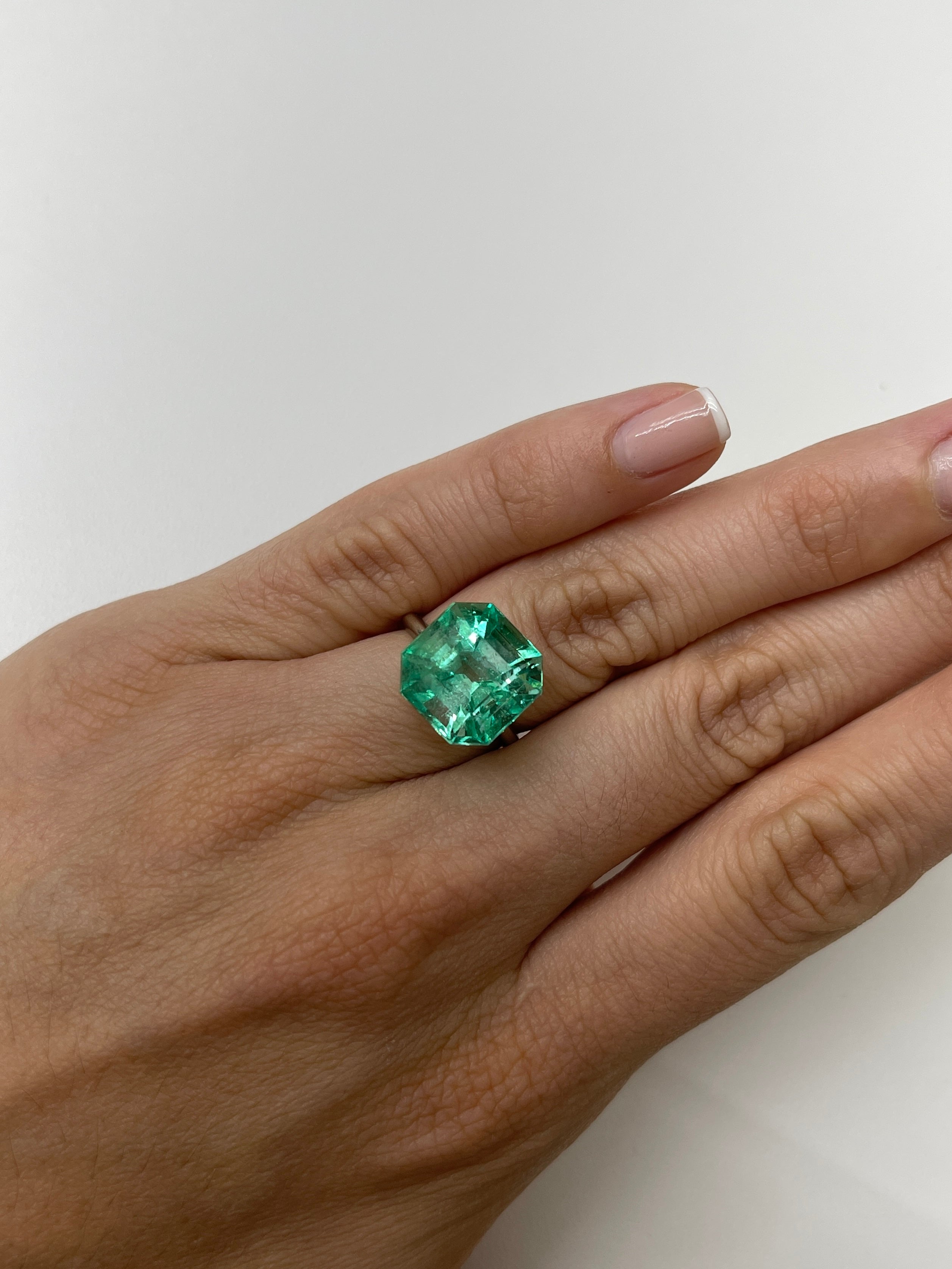 Large 10.49 carat Colombian emerald in classic Asscher cut, vibrant and natural with gemmy green color, by JR Colombian Emeralds.