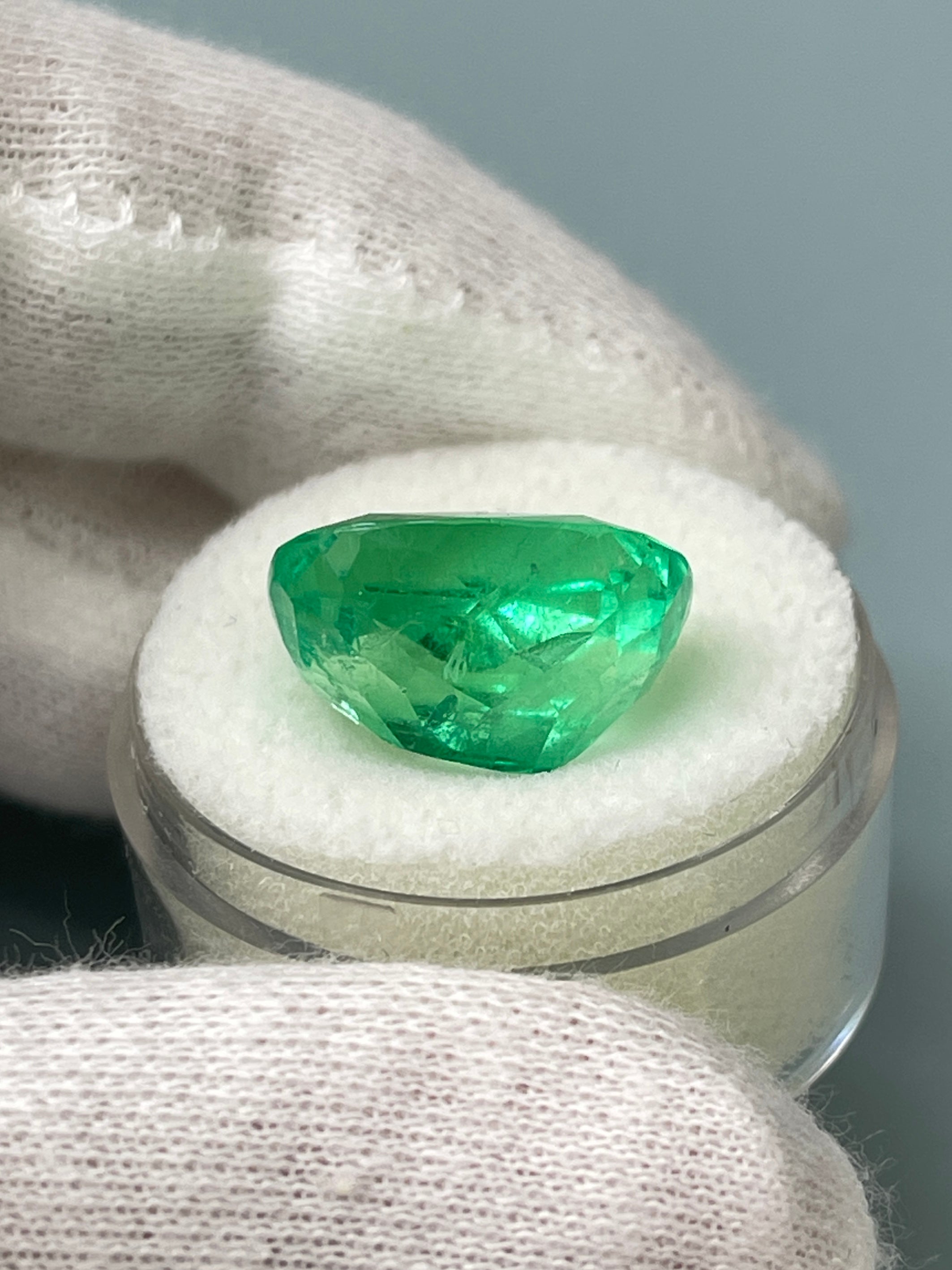 Large 11.50 carat yellowish natural Colombian cushion emerald with a spready cut, from JR Colombian Emeralds.