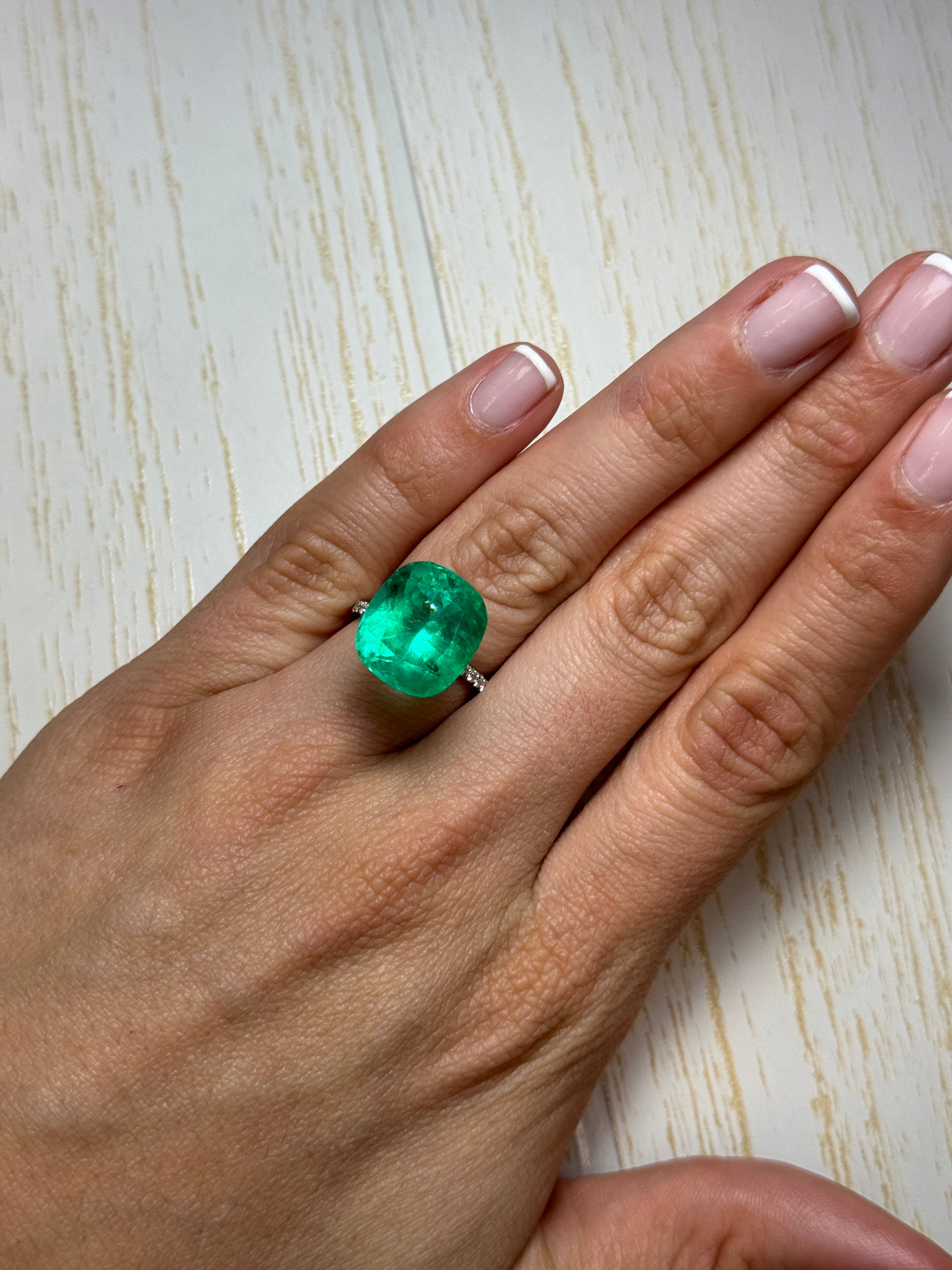 Large 12.50 carat green Colombian emerald loose cushion cut gemstone from JR Colombian Emeralds.