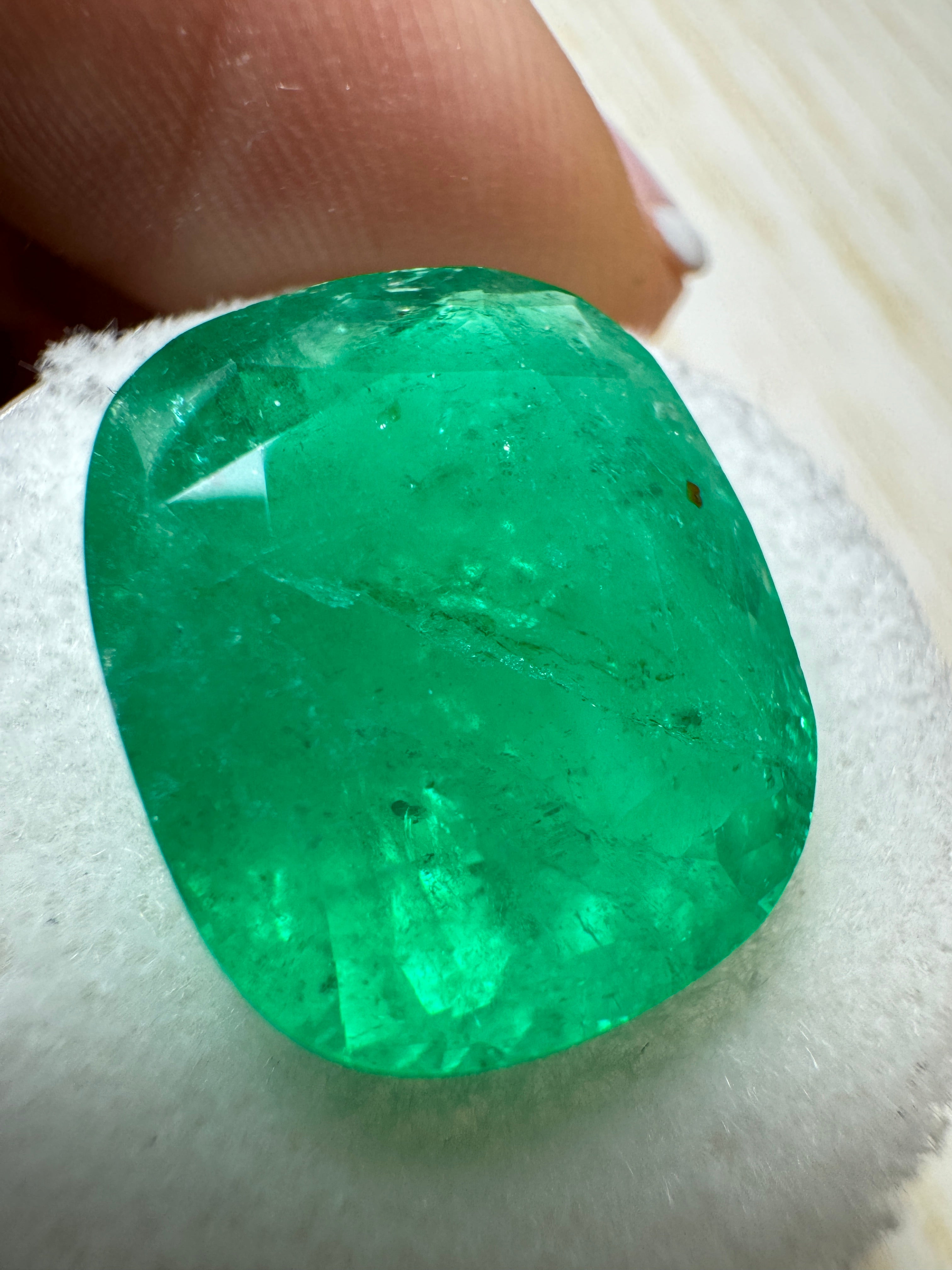 Large 12.81 carat natural Colombian emerald, cushion cut, vibrant green loose gemstone by JR Colombian Emeralds.