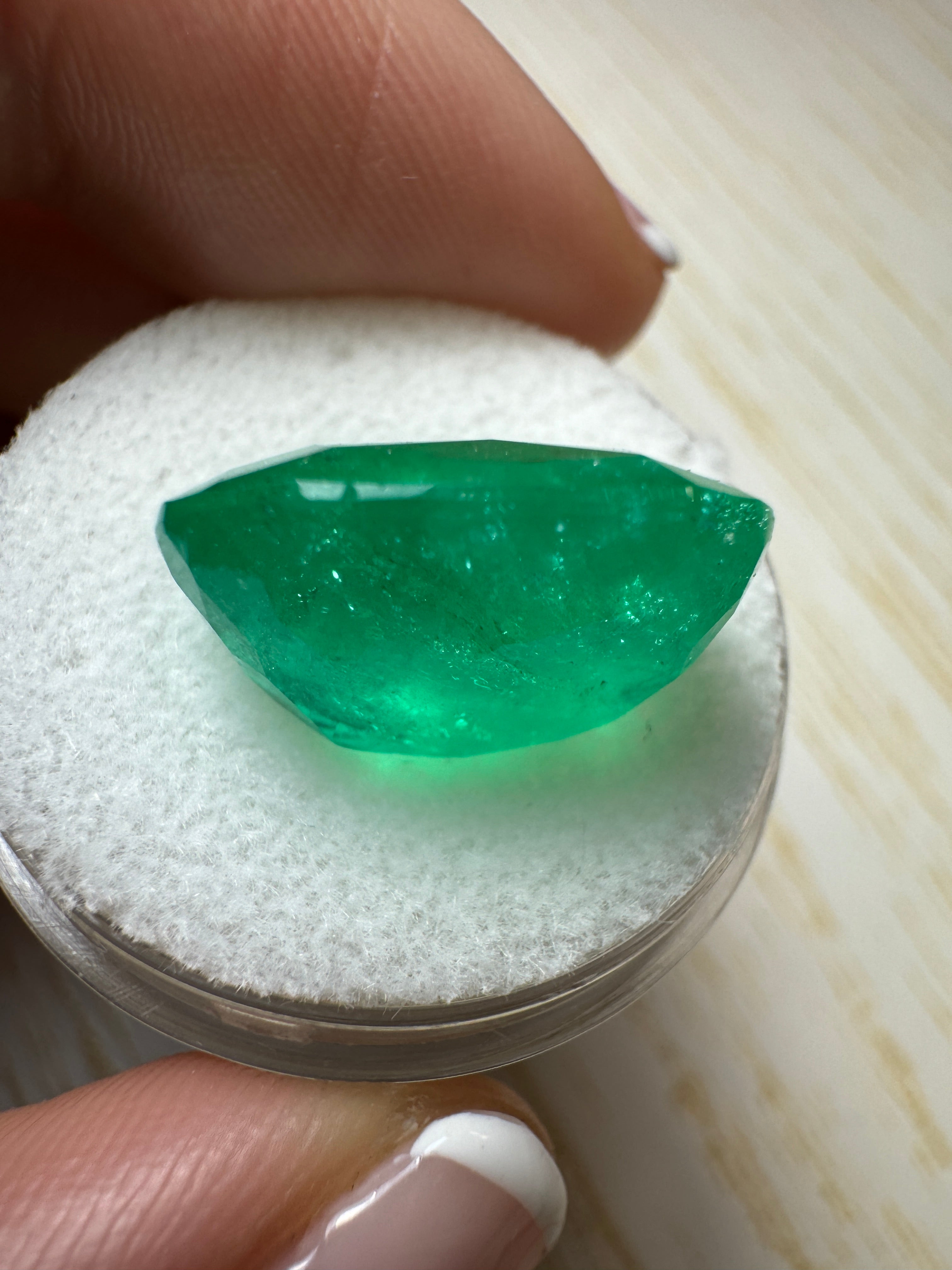 Large 12.81 carat green natural Colombian emerald loose cushion cut gemstone by JR Colombian Emeralds.