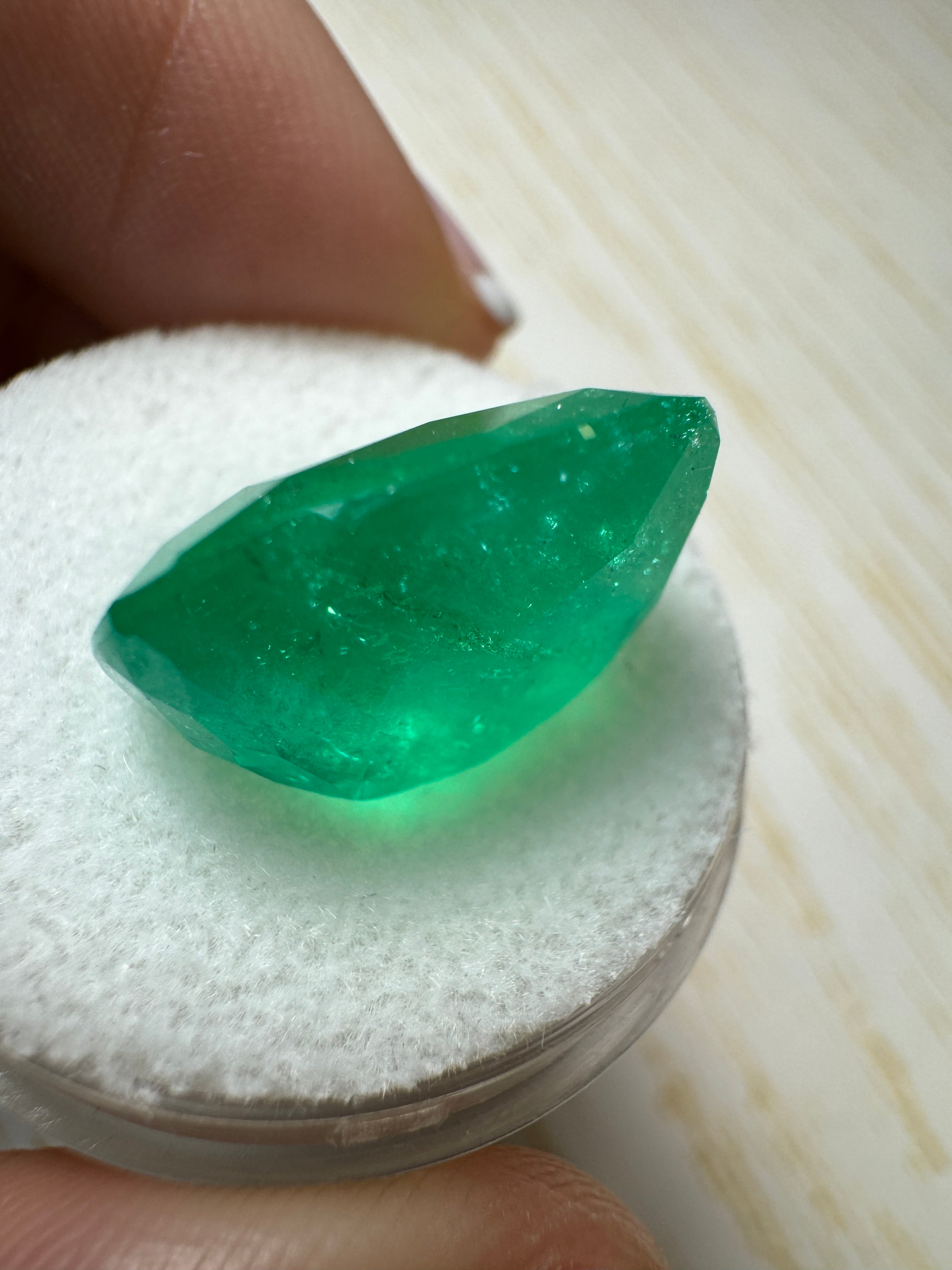 Large 12.81 carat green Colombian emerald loose cushion cut gemstone from JR Colombian Emeralds.