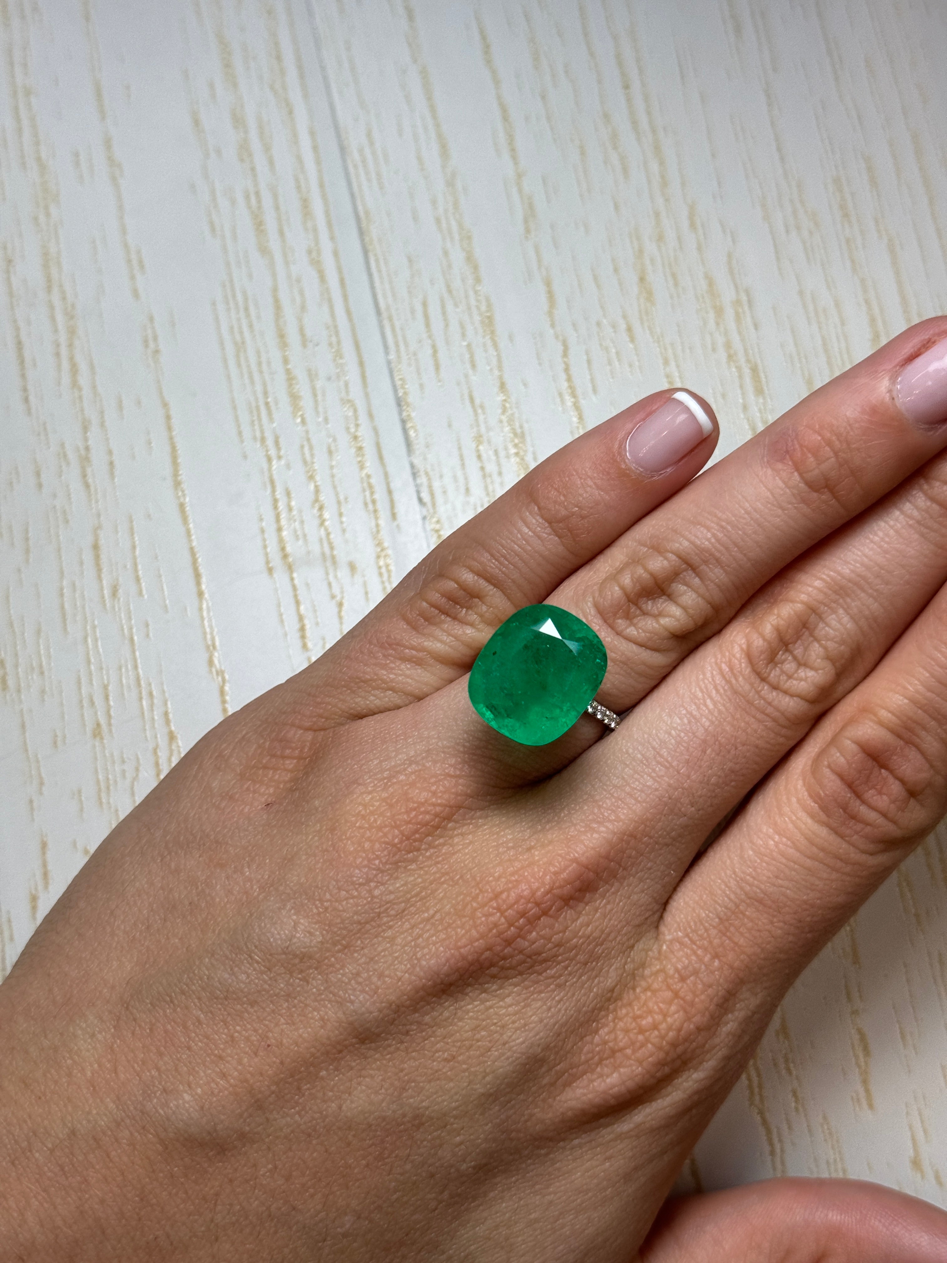 Large 12.81 carat green Colombian emerald loose cushion cut gemstone from JR Colombian Emeralds. Natural and stunning.