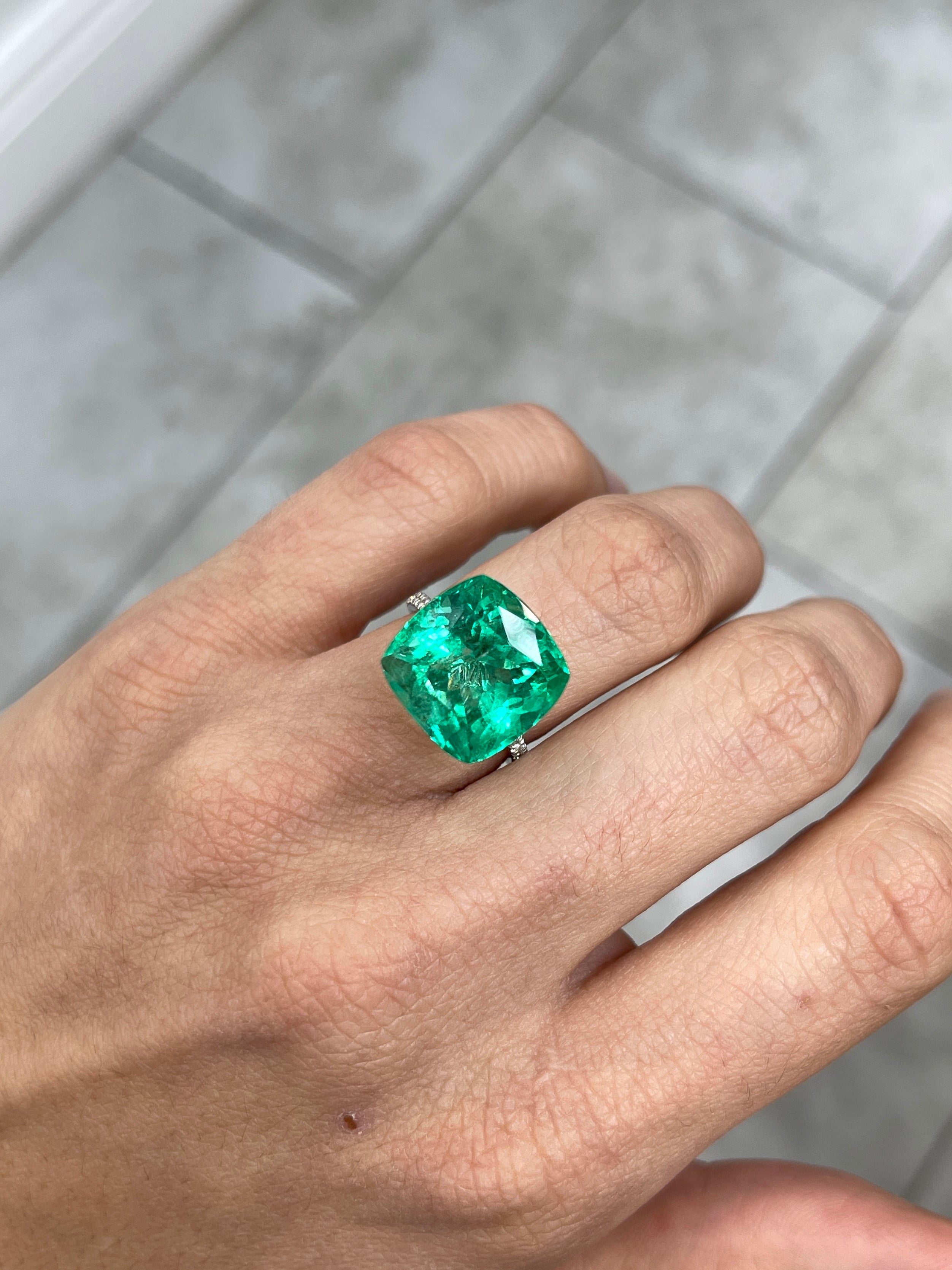 Large 13.88-carat bluish green cushion cut Colombian emerald, ethically mined, from JR Colombian Emeralds.