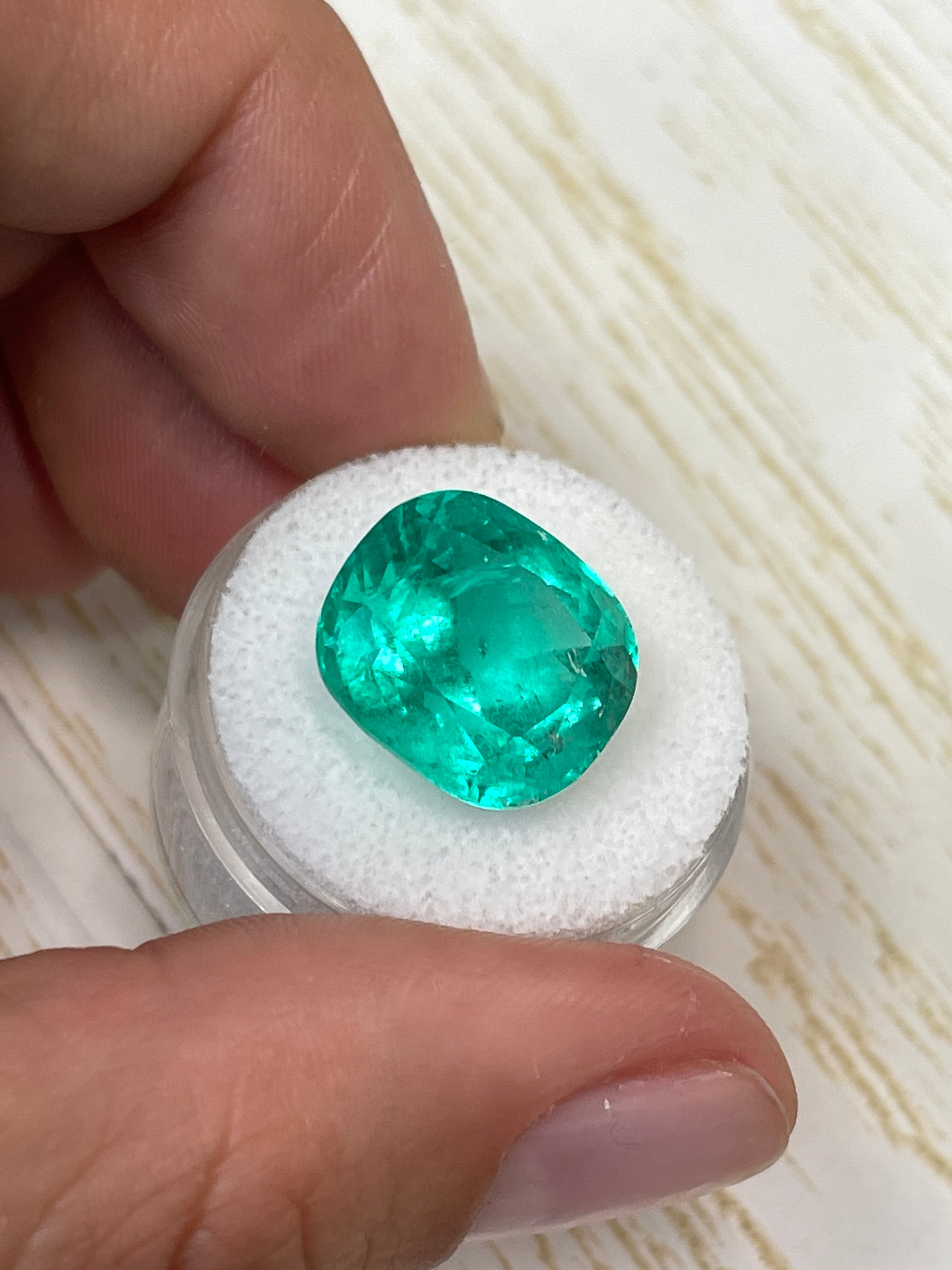 Large 14.44 carat bluish green natural Colombian emerald loose cushion cut gemstone by JR Colombian Emeralds.