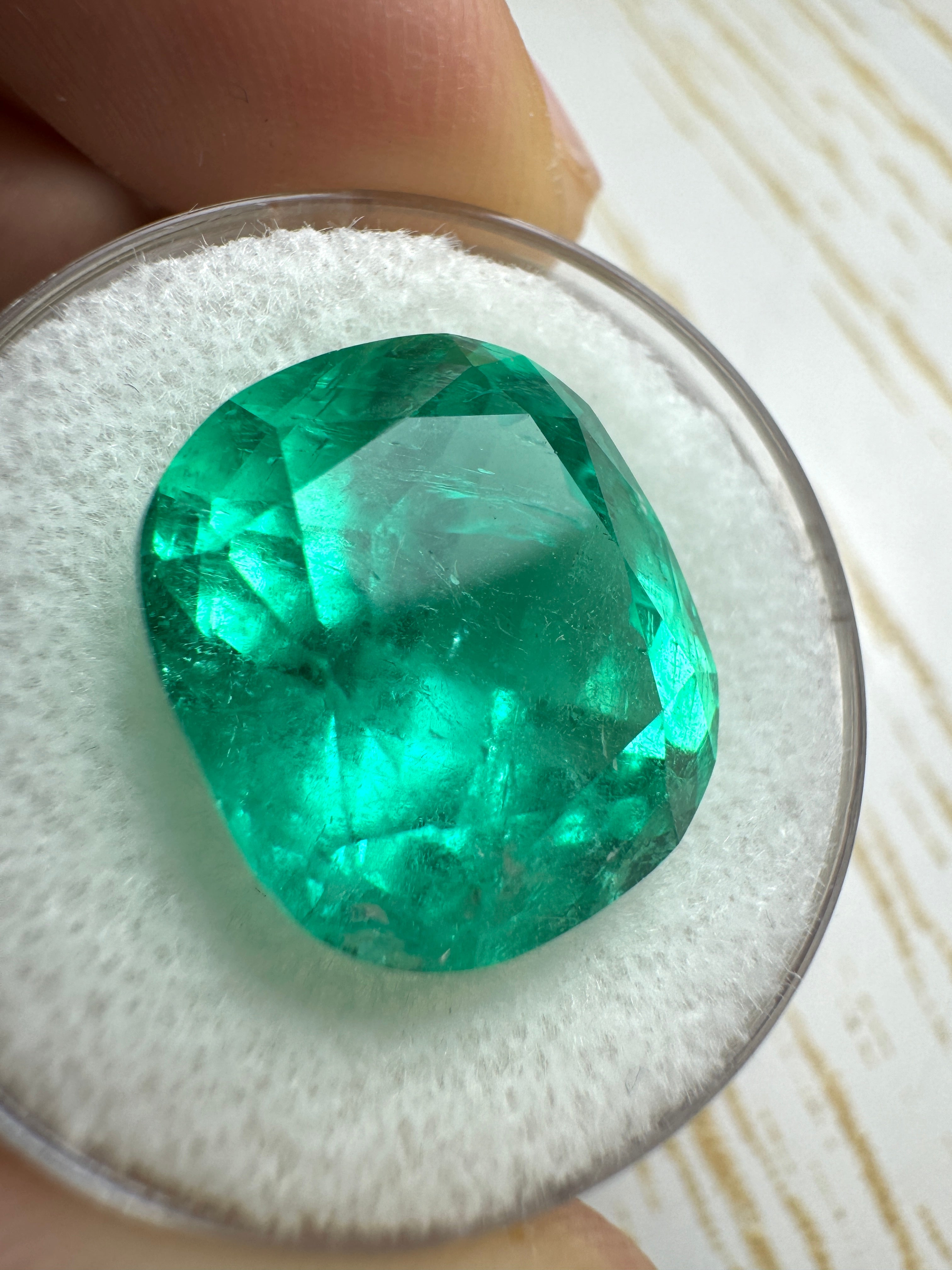 Large 14.44 Carat bluish green Colombian emerald loose cushion cut gemstone from JR Colombian Emeralds.