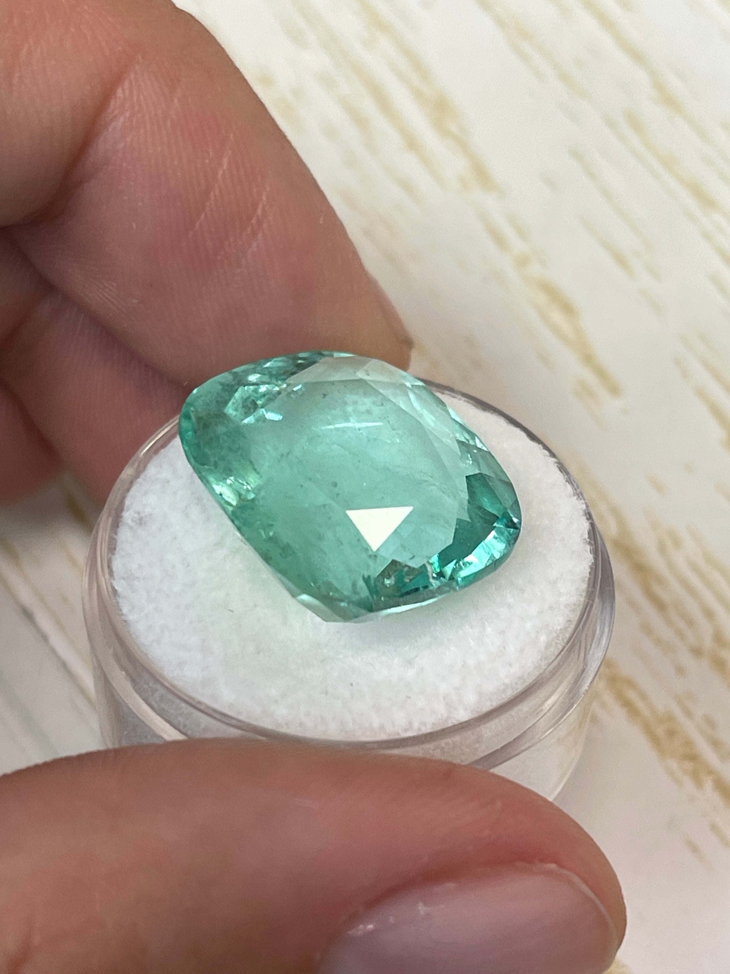 Large 19.41 carat pastel green Colombian emerald loose cushion cut gem, VS clarity, natural and vibrant.