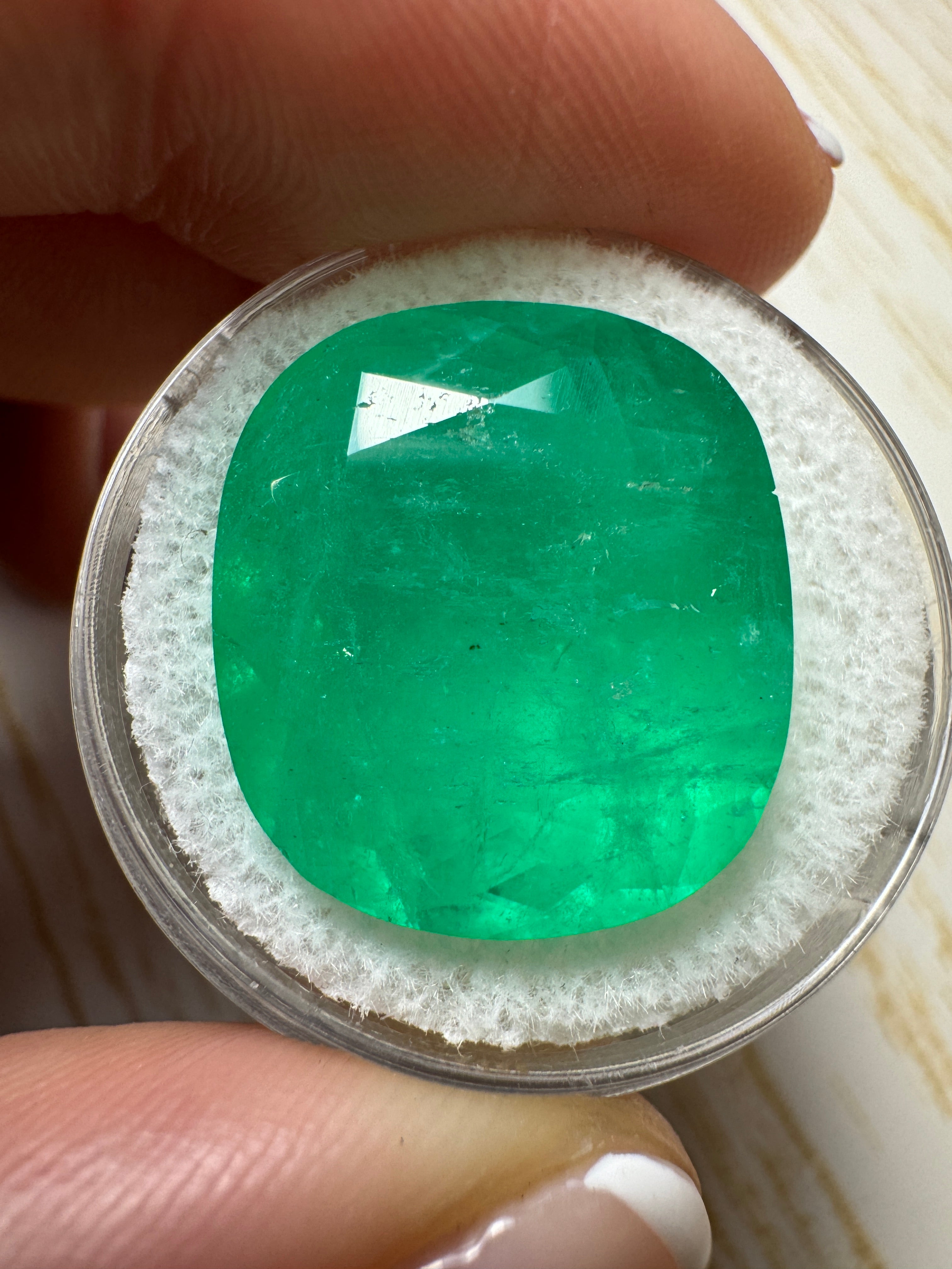 Large 19.63 carat chunky green natural Colombian emerald loose cushion cut gemstone from JR Colombian Emeralds.