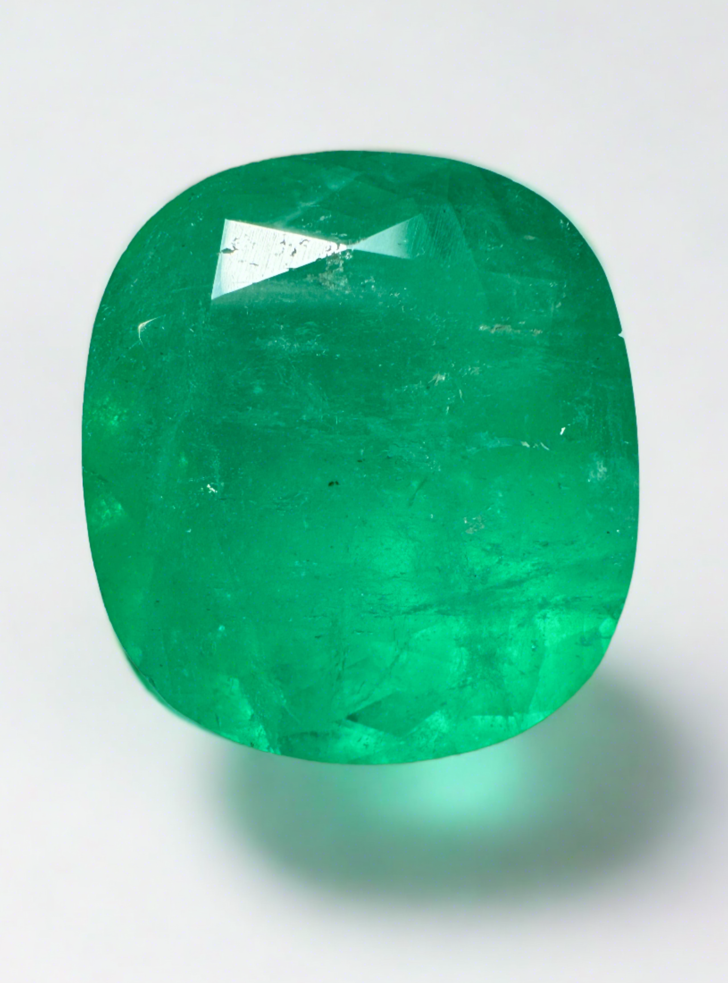 Large 19.63 carat chunky green natural Colombian emerald cushion cut gemstone from JR Colombian Emeralds.
