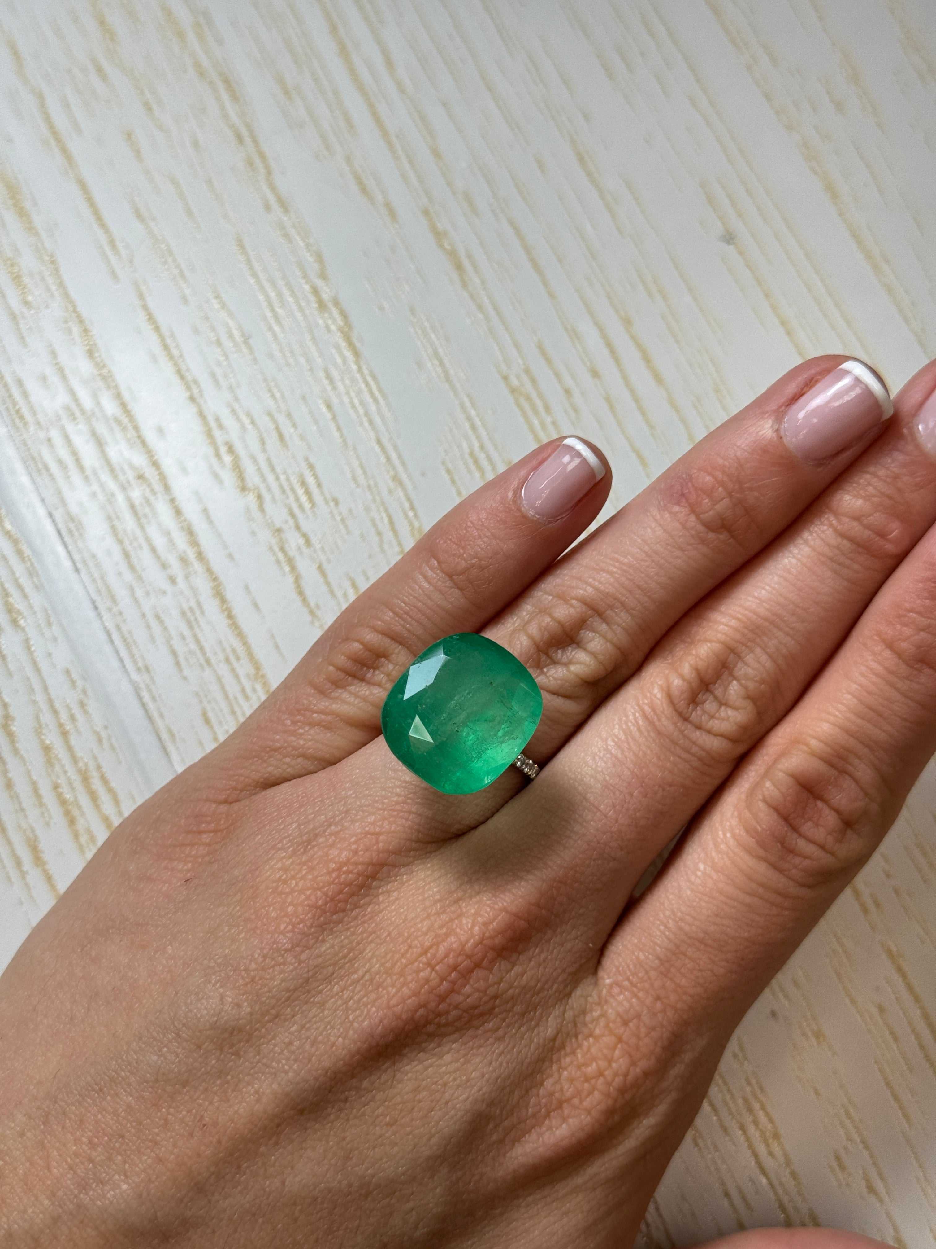 Large 21.62 carat earthy green natural Colombian emerald loose cushion cut gemstone by JR Colombian Emeralds.