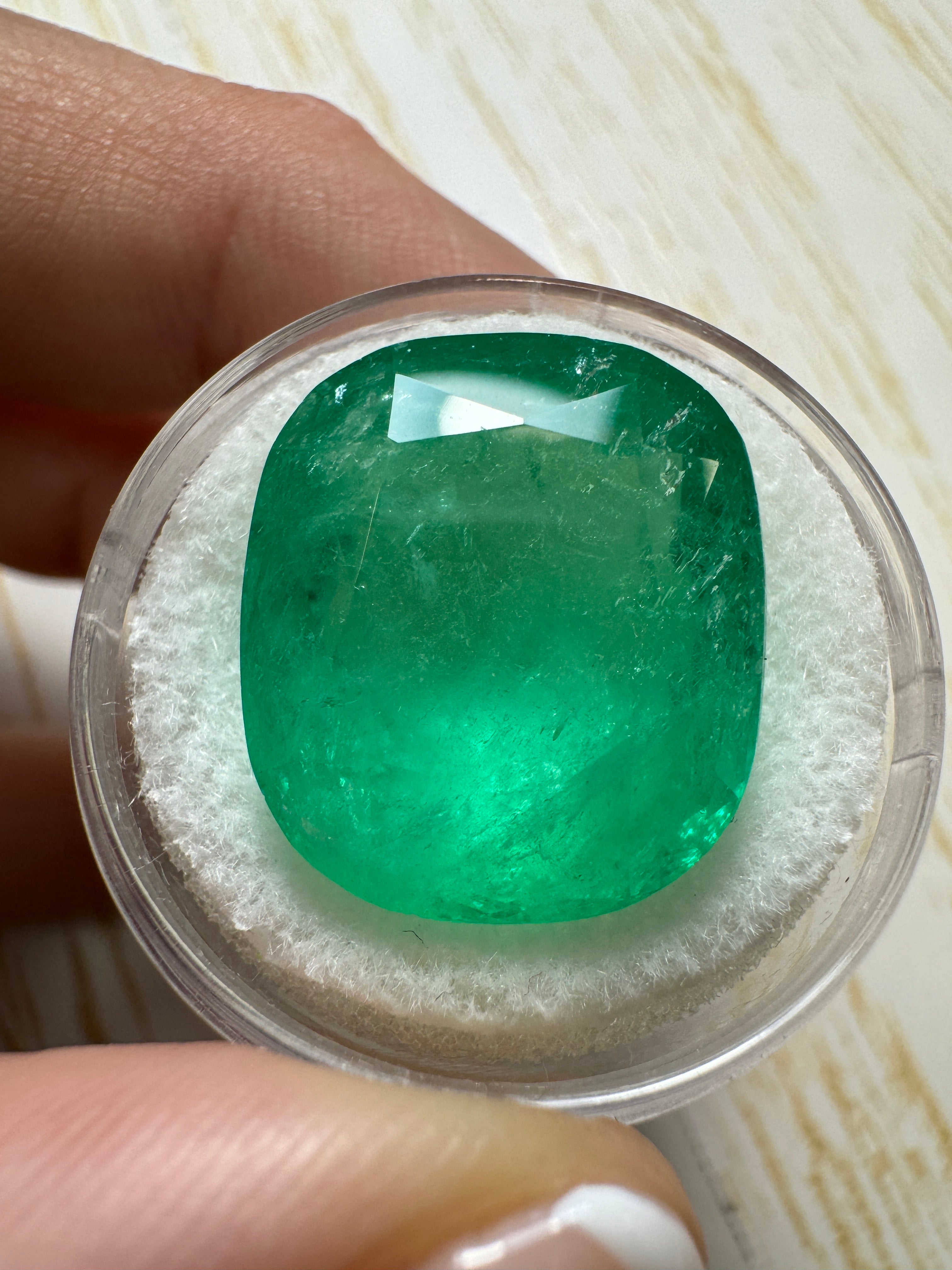 Large 22.61 carat spring green Colombian emerald loose cushion cut gemstone from JR Colombian Emeralds.