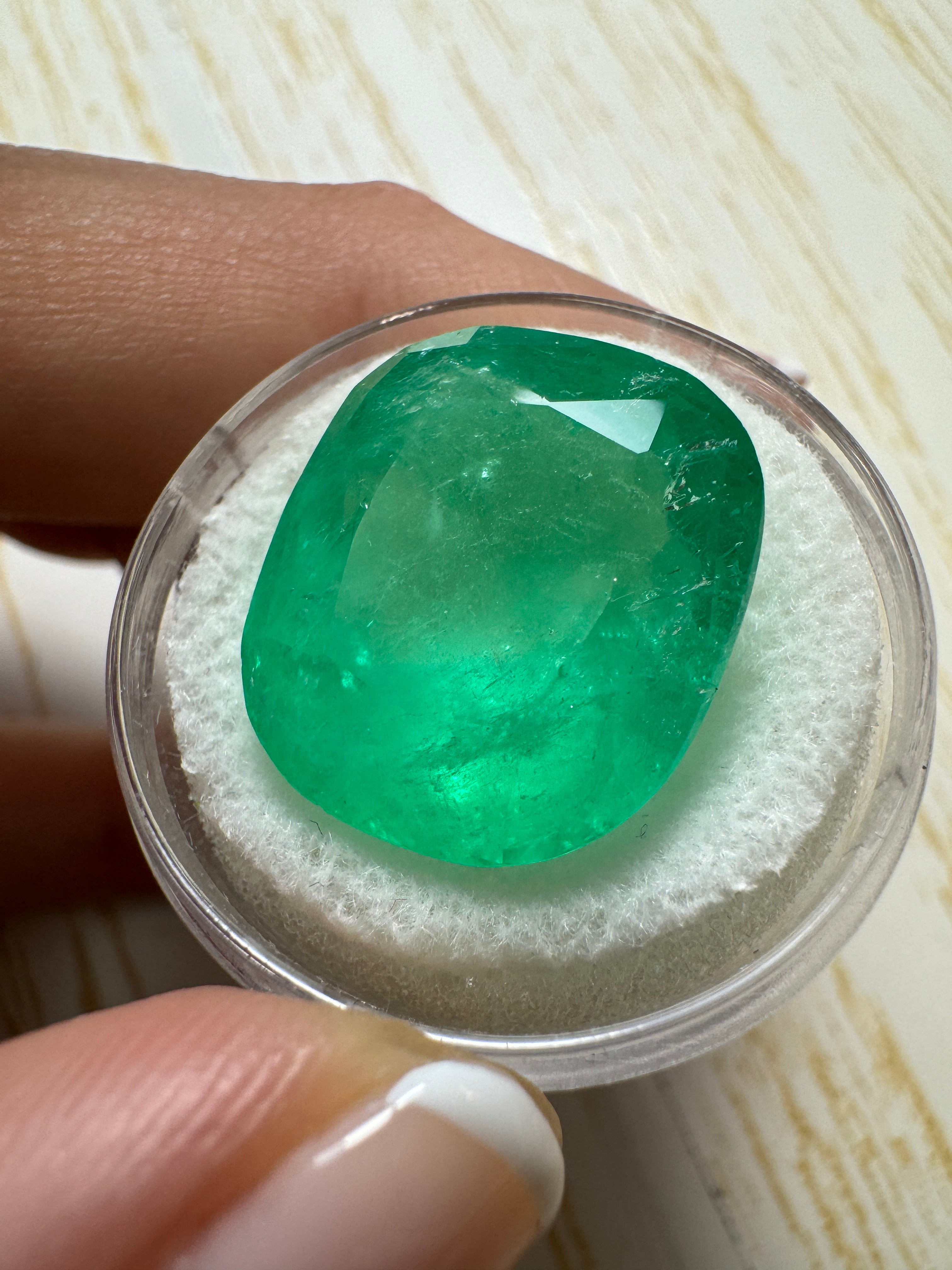 Large 22.61 carat spring green Colombian emerald loose cushion cut gemstone from JR Colombian Emeralds.