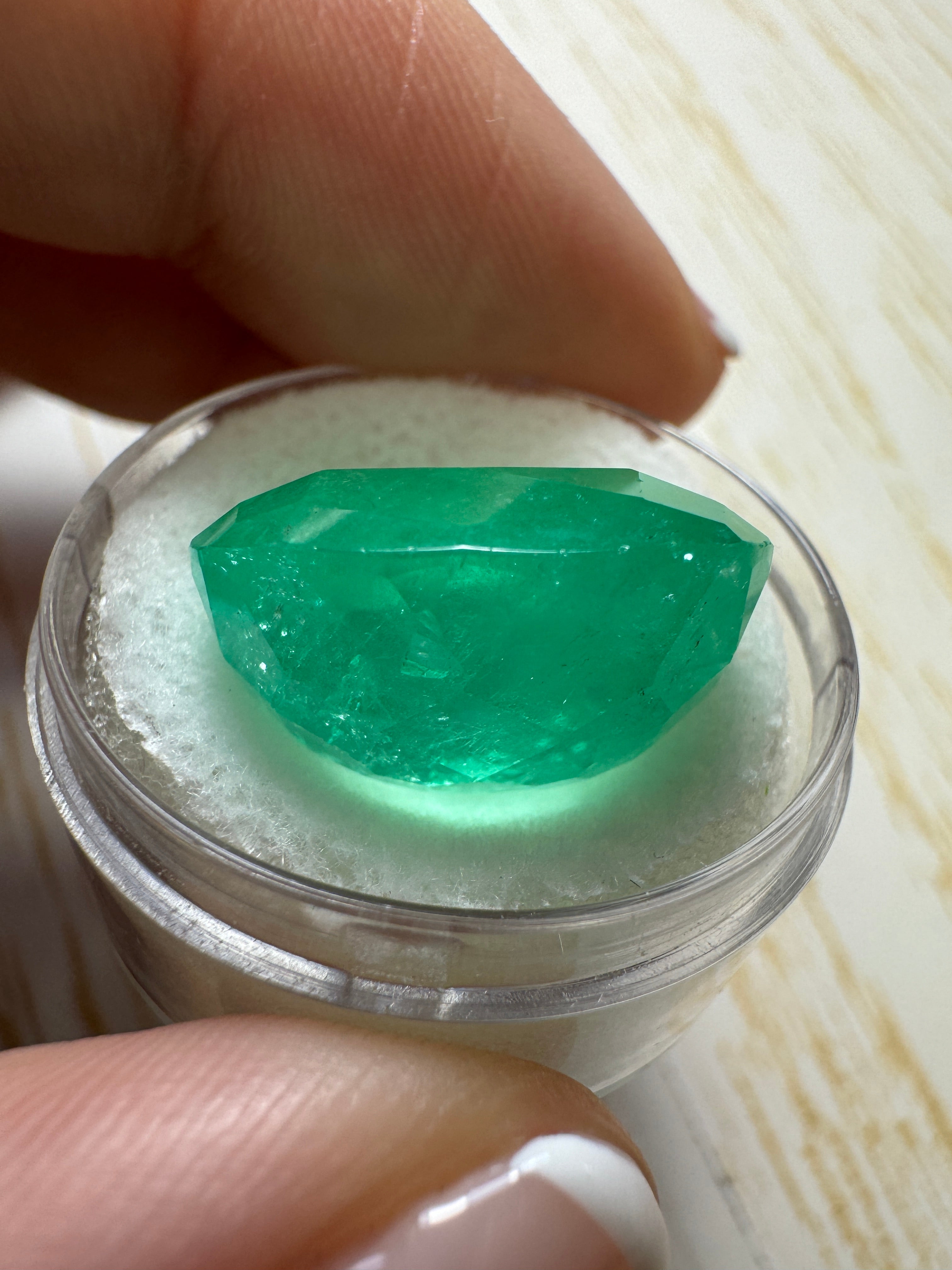 Large 22.61-carat spring green Colombian emerald in cushion cut, natural loose gemstone from JR Colombian Emeralds.