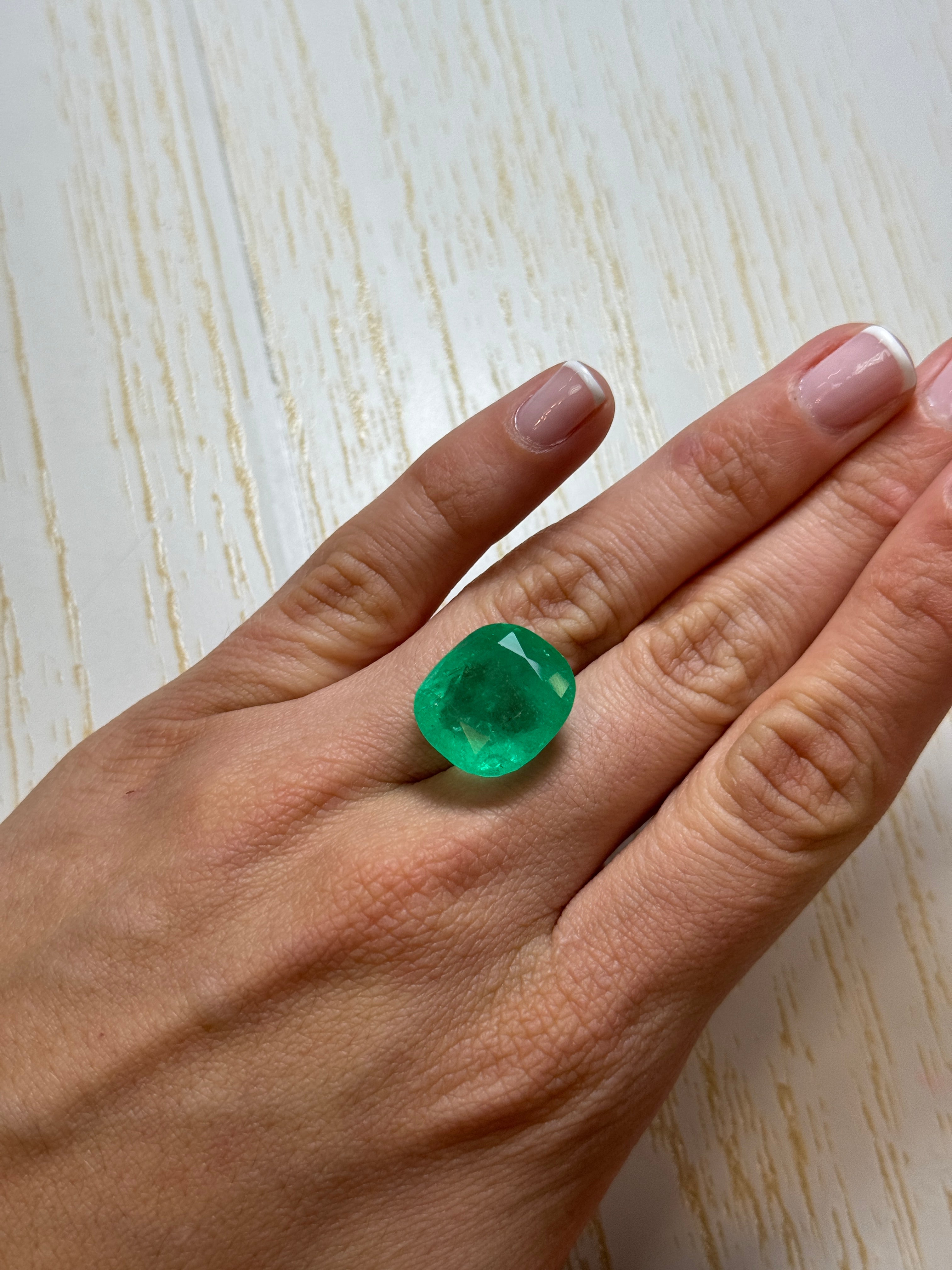 Large 22.61 carat spring green Colombian emerald loose cushion cut gemstone from JR Colombian Emeralds.