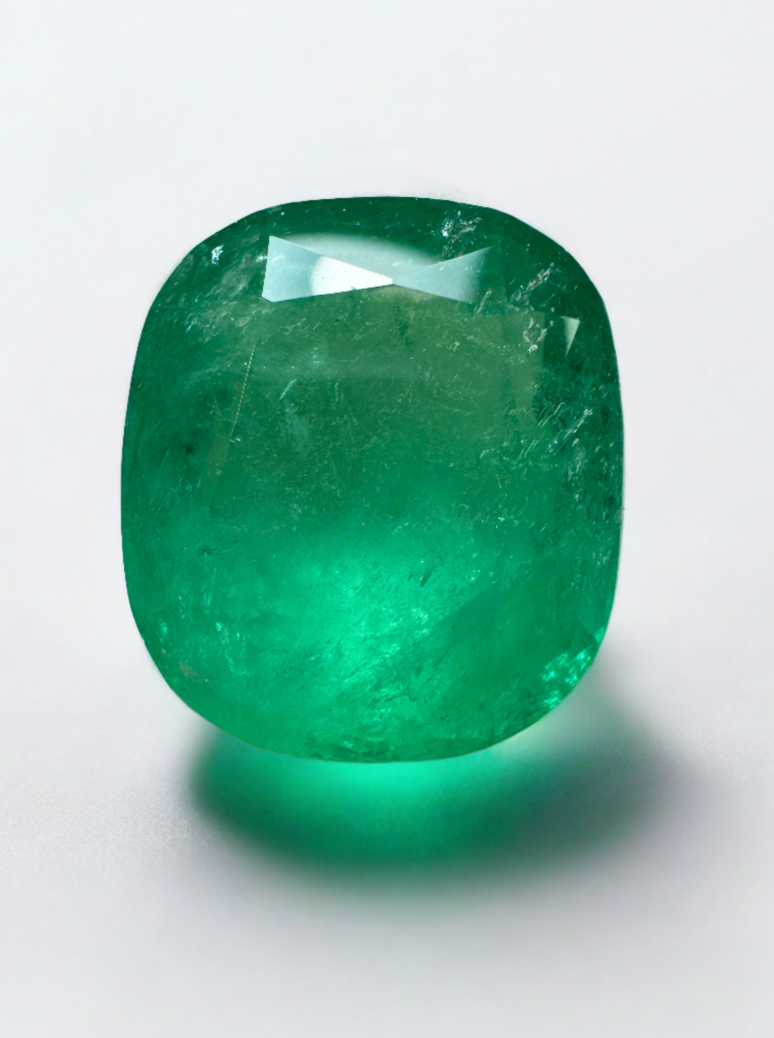 Large 22.61 carat spring green Colombian emerald loose cushion cut gemstone by JR Colombian Emeralds.