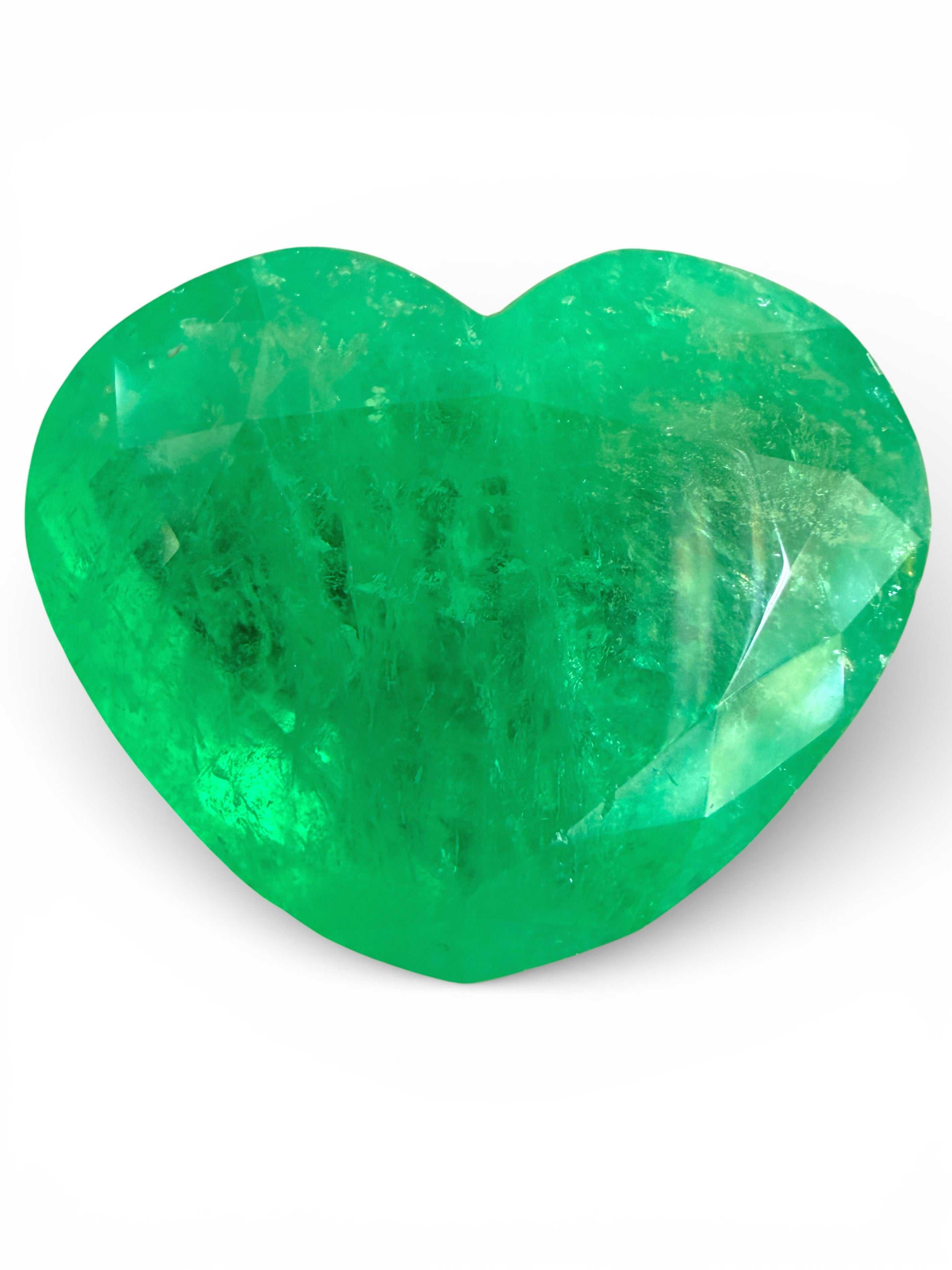 Bright green 23.97-carat Colombian emerald loose gemstone in heart cut, from JR Colombian Emeralds.