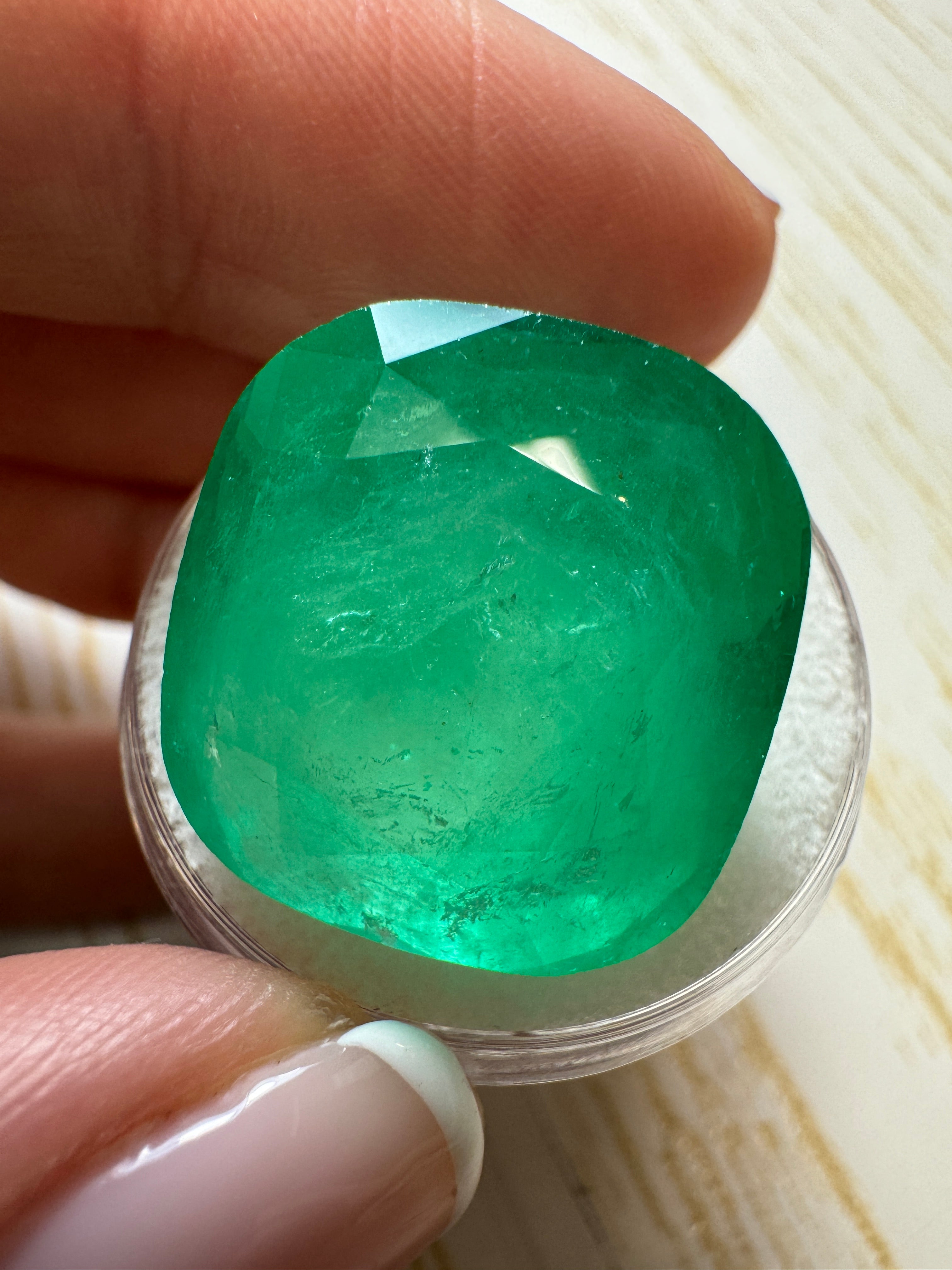Large 30.43 carat spring green Colombian emerald loose cushion cut gemstone by JR Colombian Emeralds.