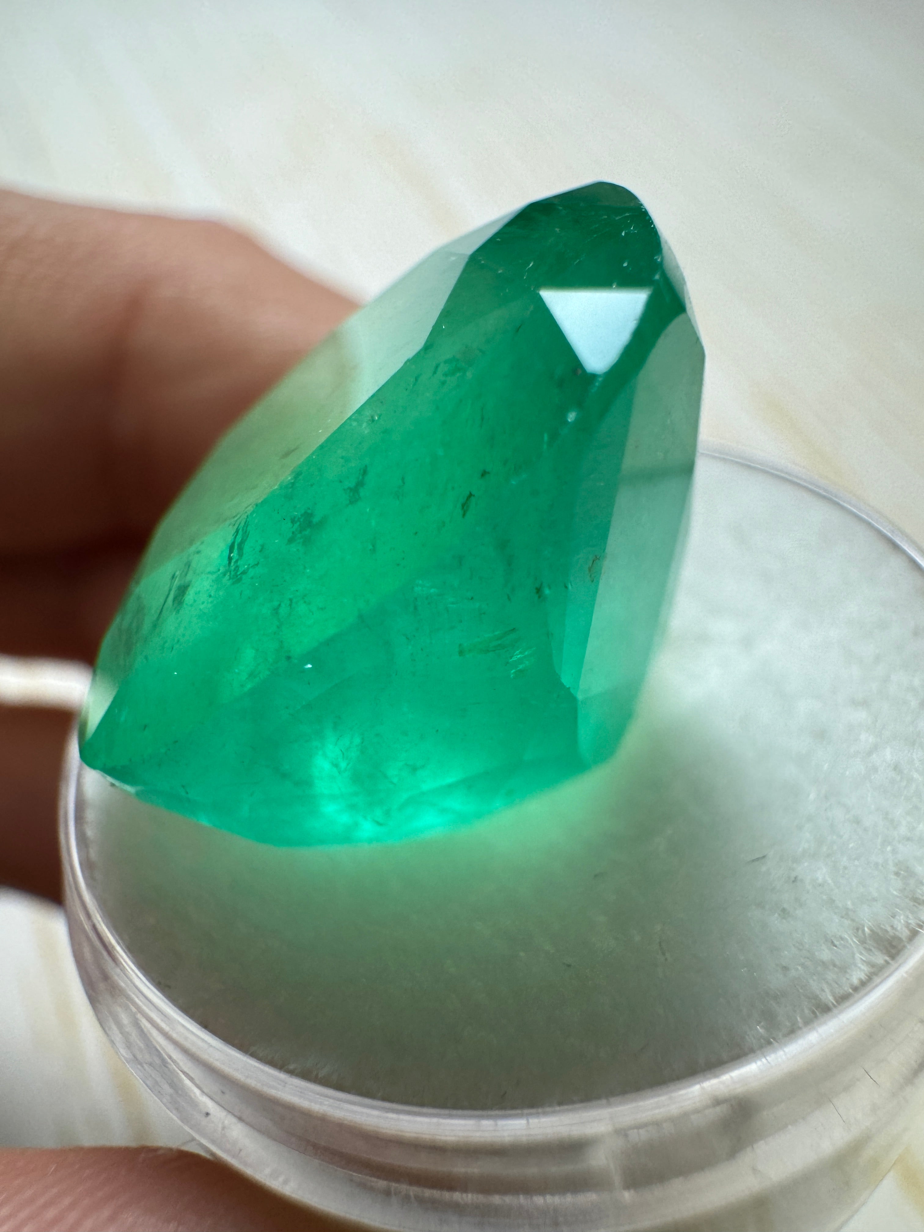 Large 30.43 carat spring green natural Colombian emerald in cushion cut, loose gemstone, from JR Colombian Emeralds.