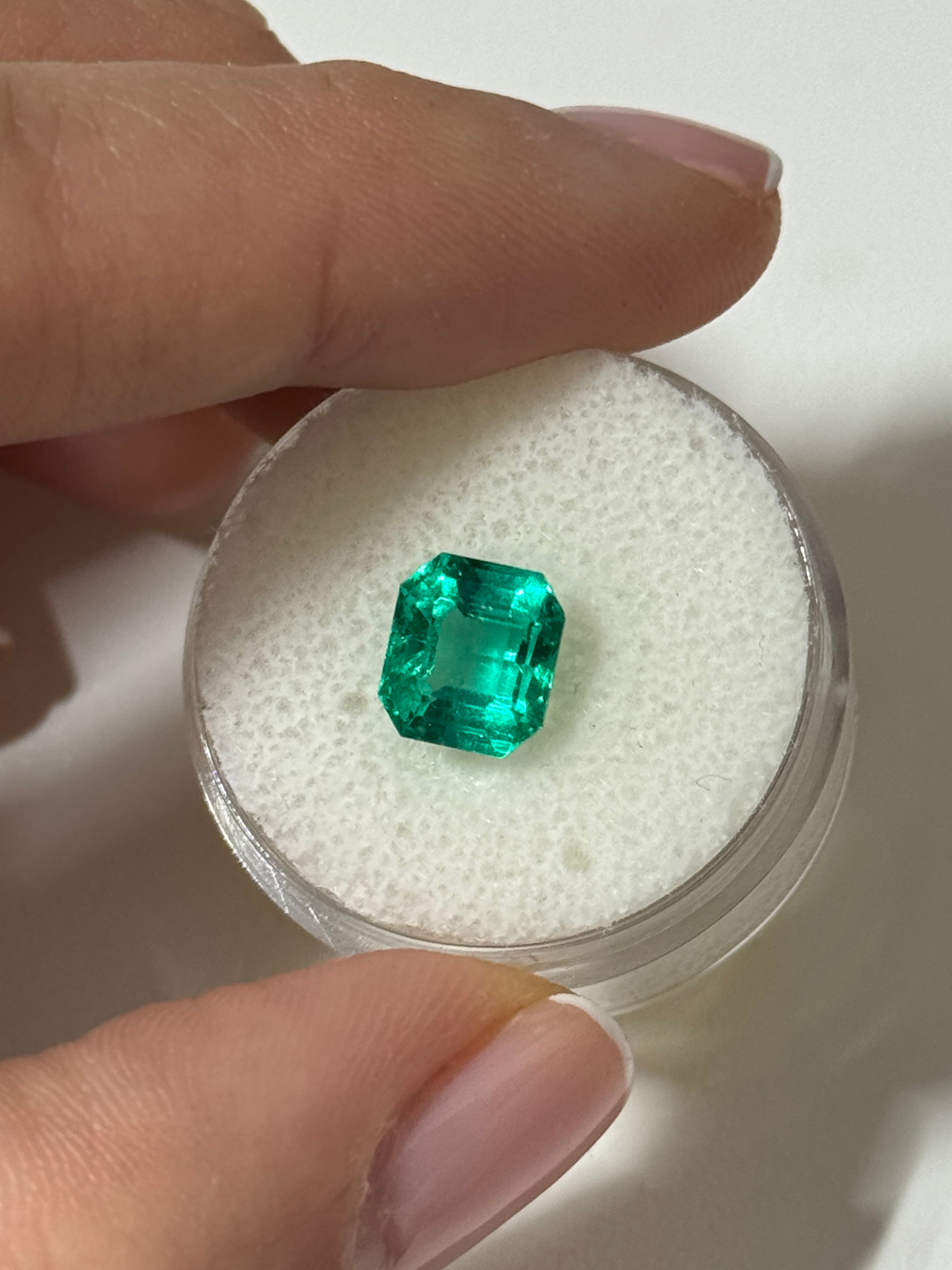2.31 carat rare no-oil Colombian emerald Asscher cut gemstone from JR Colombian Emeralds, showcasing deep green color and clarity.