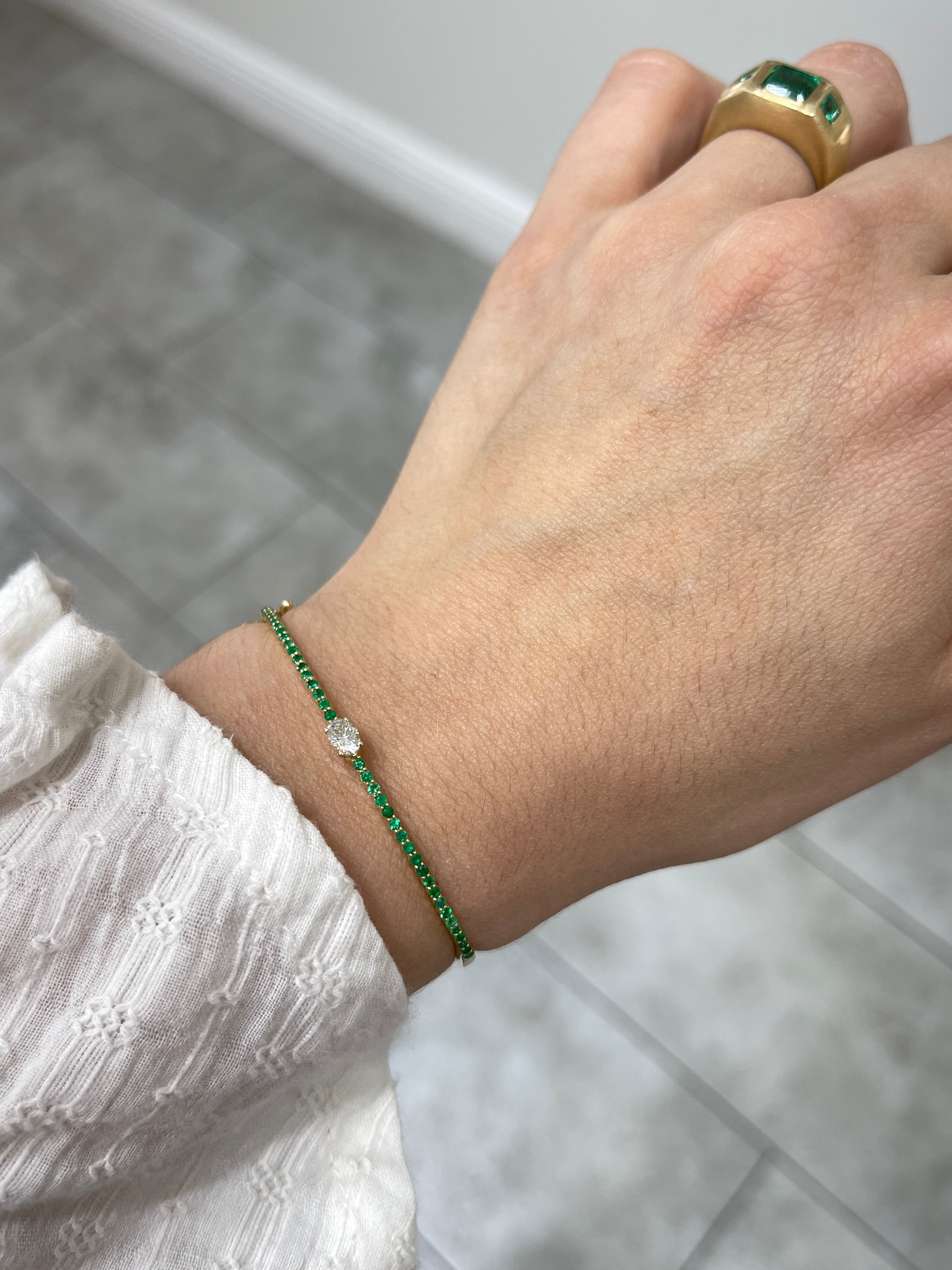Oval diamond and emerald bangle bracelet in 14K yellow gold, designed for a 5.5-inch wrist, by JR Colombian Emeralds.