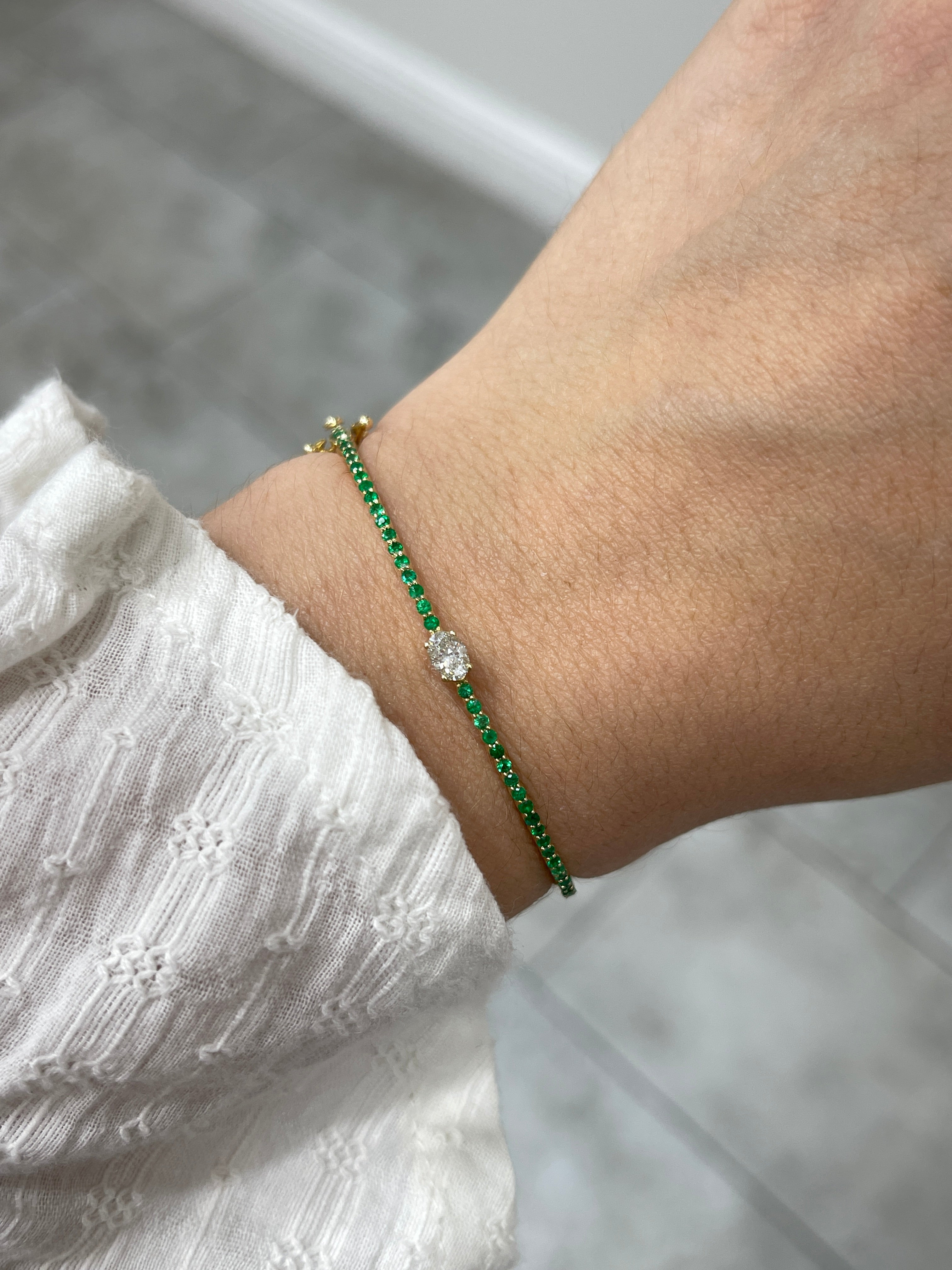Oval diamond and emerald bangle bracelet in 14K yellow gold, designed for a 5.5-inch wrist, by JR Colombian Emeralds.