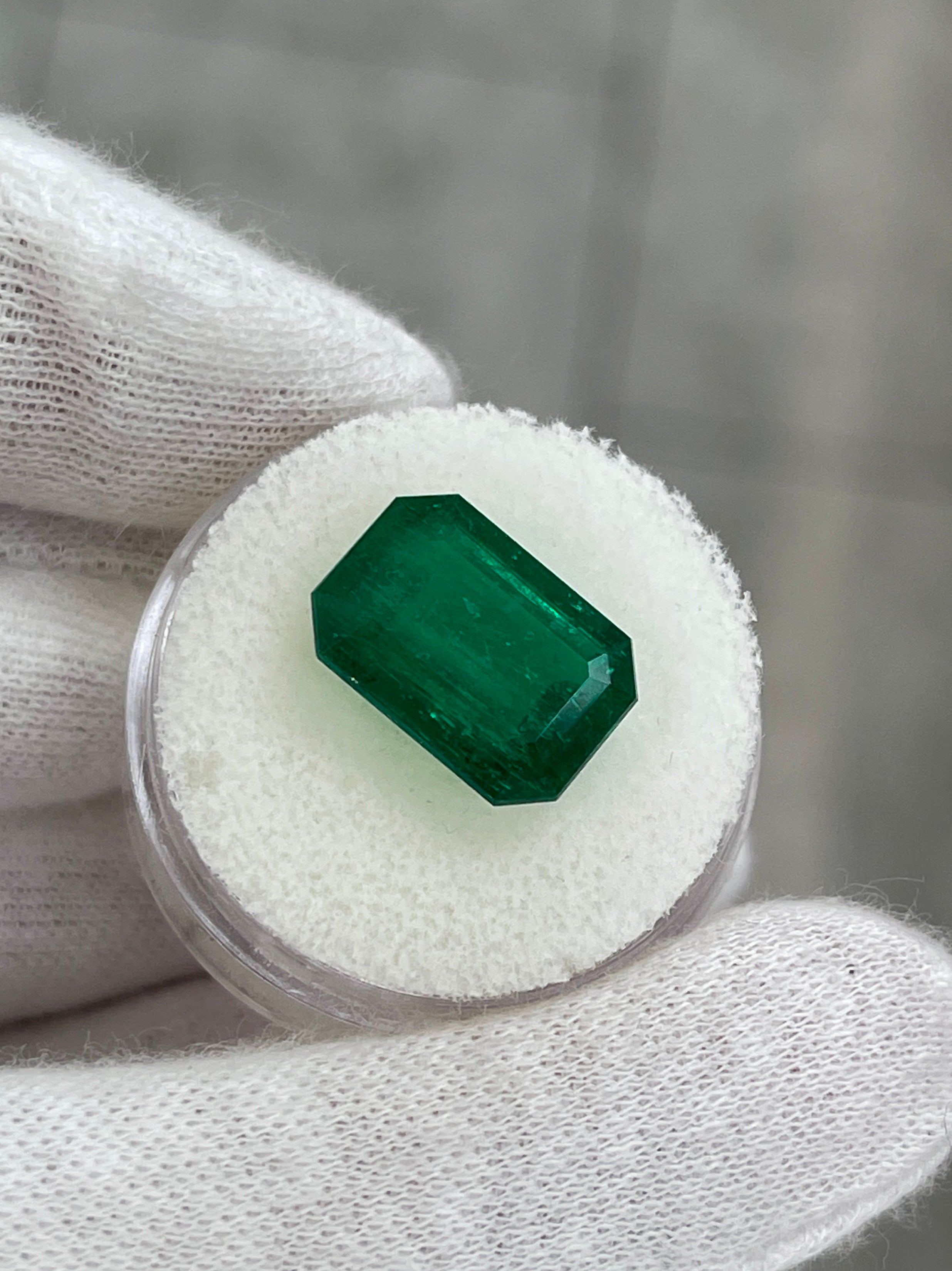 6.39 Carat Vivid Muzo Green Colombian Emerald cut loose gemstone by JR Colombian Emeralds, double certified AAA+ quality.