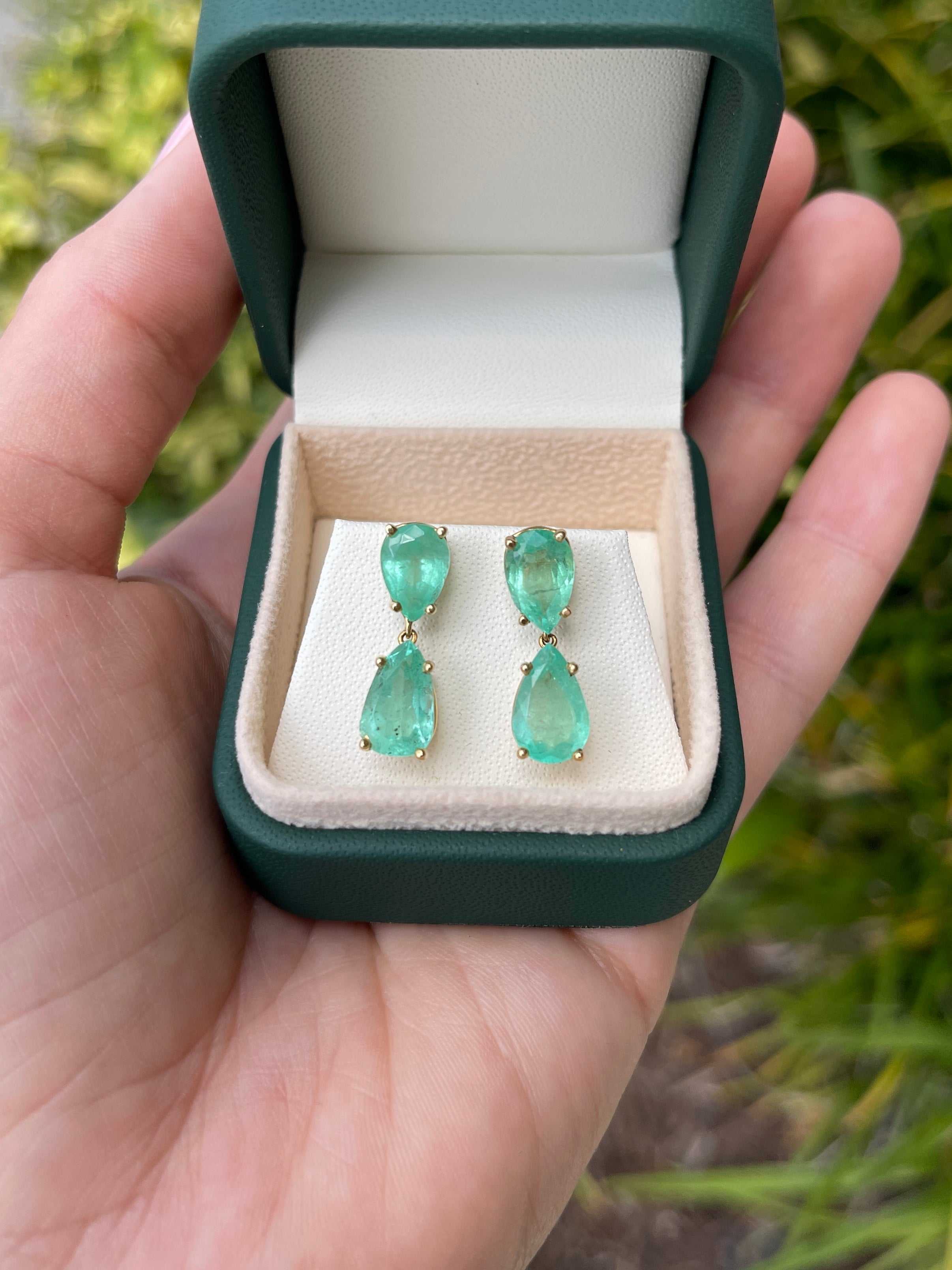 Natural Colombian emerald teardrop dangle earrings in 14K gold with 7.54tcw, featuring elegant green gemstones.