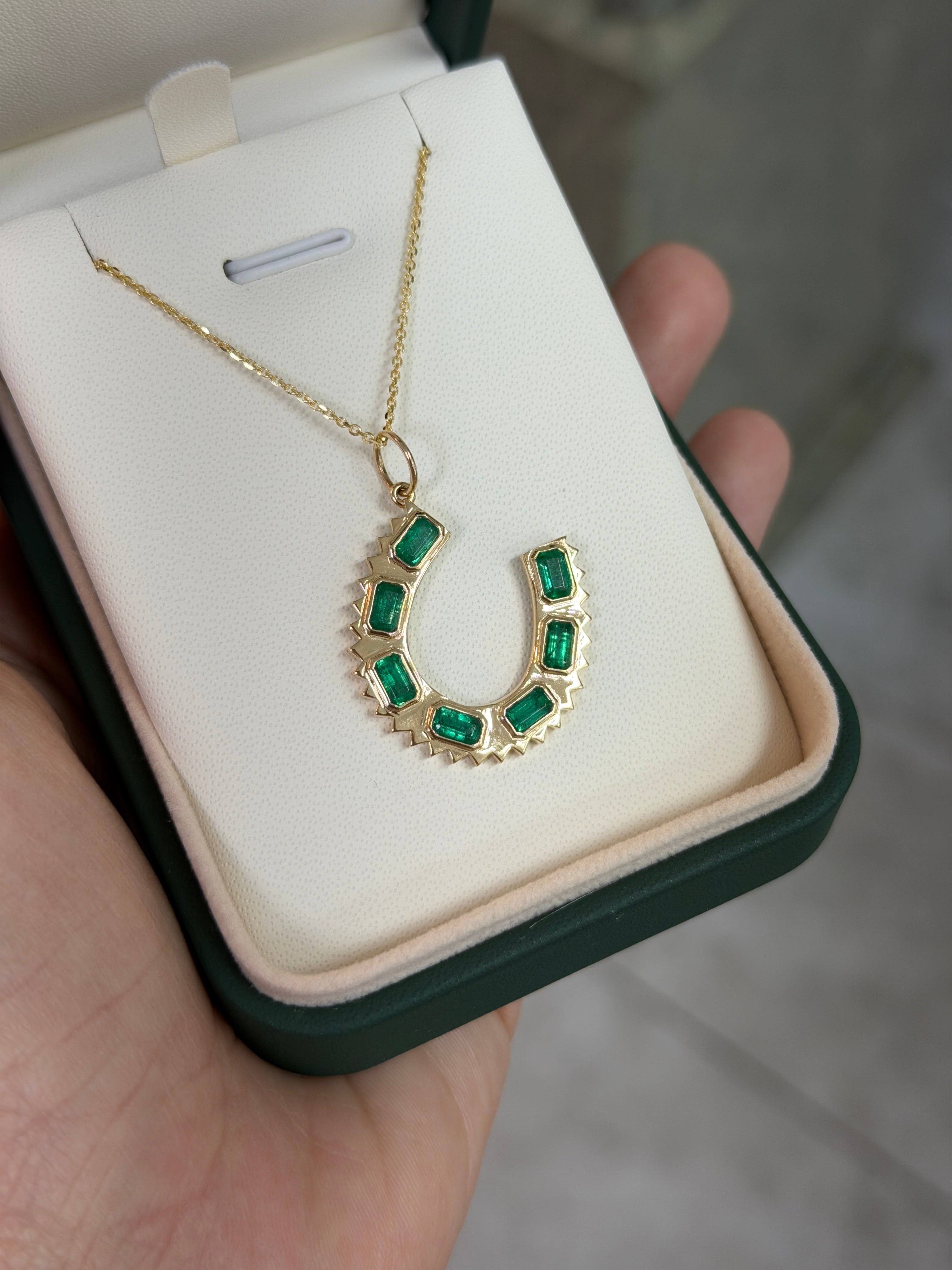 14K gold emerald cut horseshoe charm pendant necklace with 2.24tcw natural emerald from JR Colombian Emeralds.