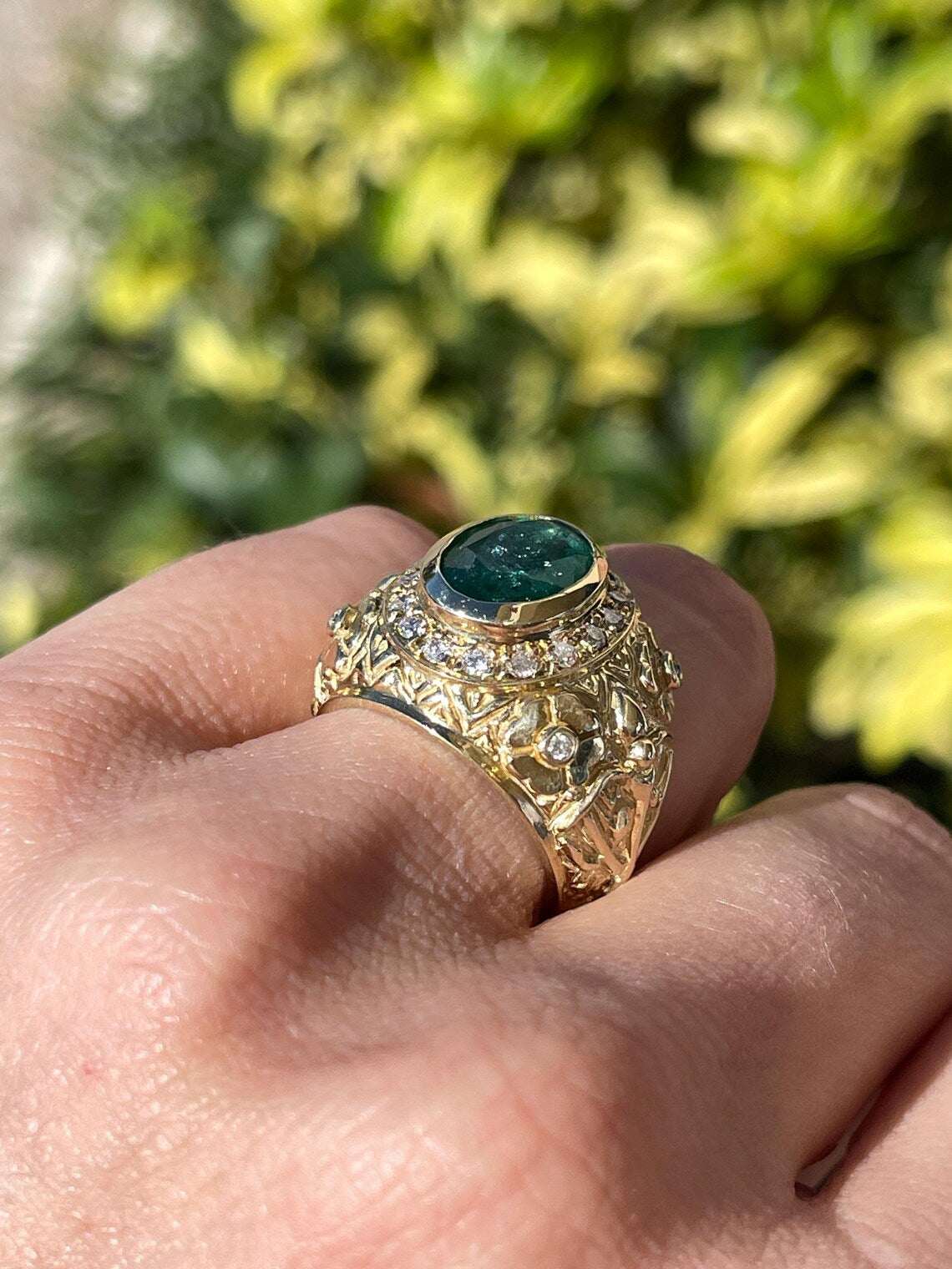 3.23ct Floral Oval Emerald Features Diamond Halo in Bold Statement Ring