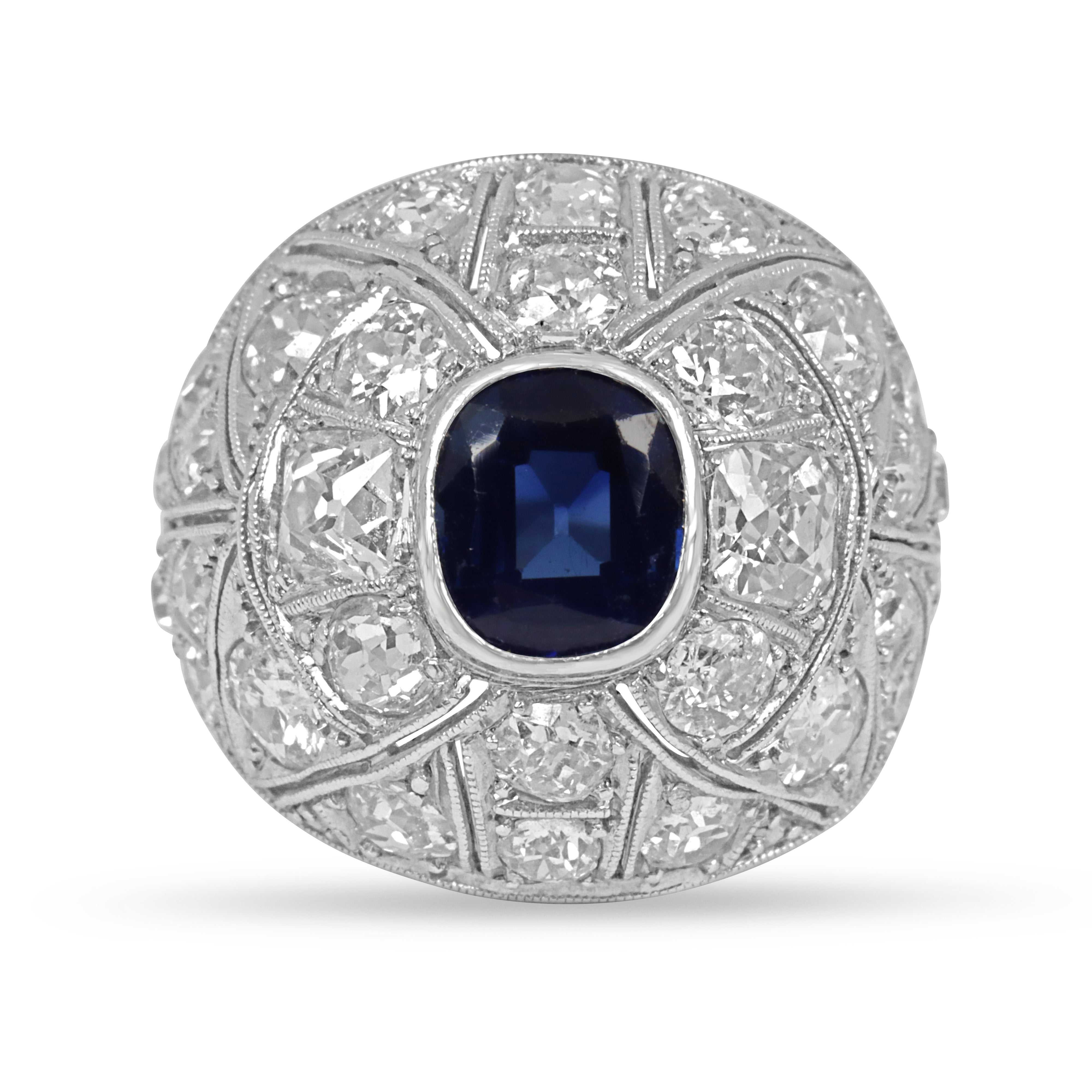 4.60tcw 18K white gold cushion sapphire and old European cut diamond Art Deco cocktail ring from 1920s