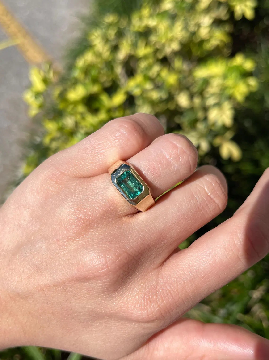 Men's ring featuring a 2.66 carat natural emerald cut emerald bezel set in a blue-green color, from JR Colombian Emeralds.