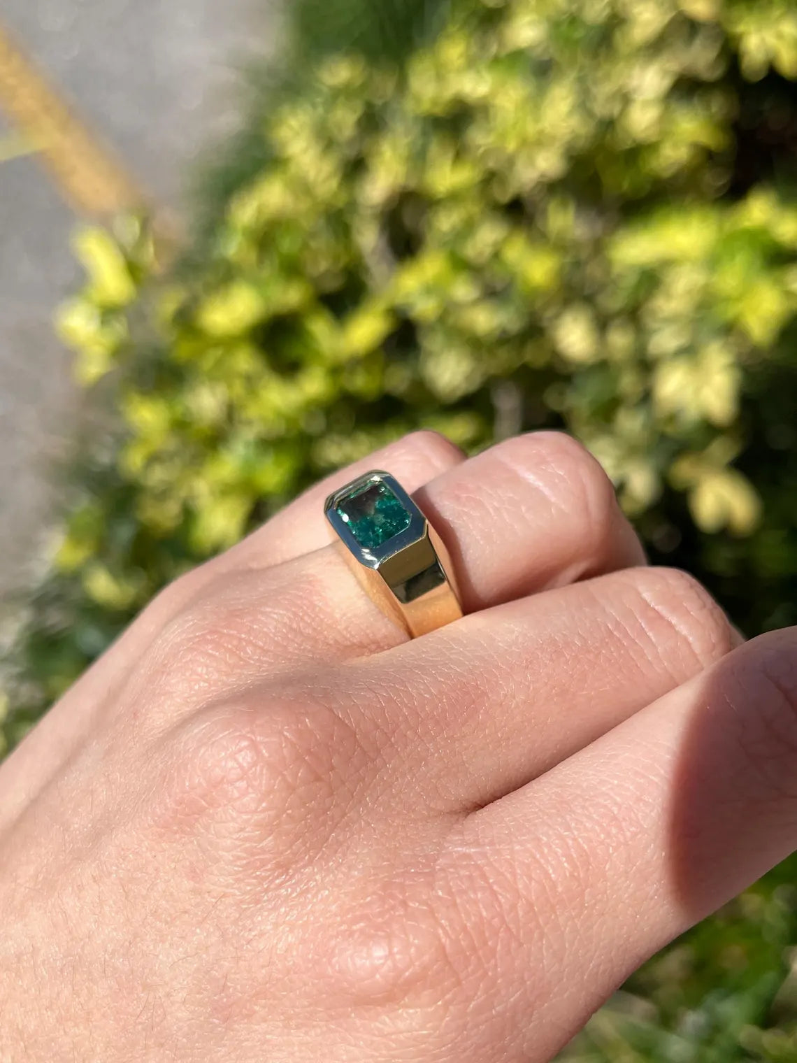 Men's ring featuring a 2.66 carat natural emerald cut emerald with bluish green hue, bezel-set in a JR Colombian Emeralds design