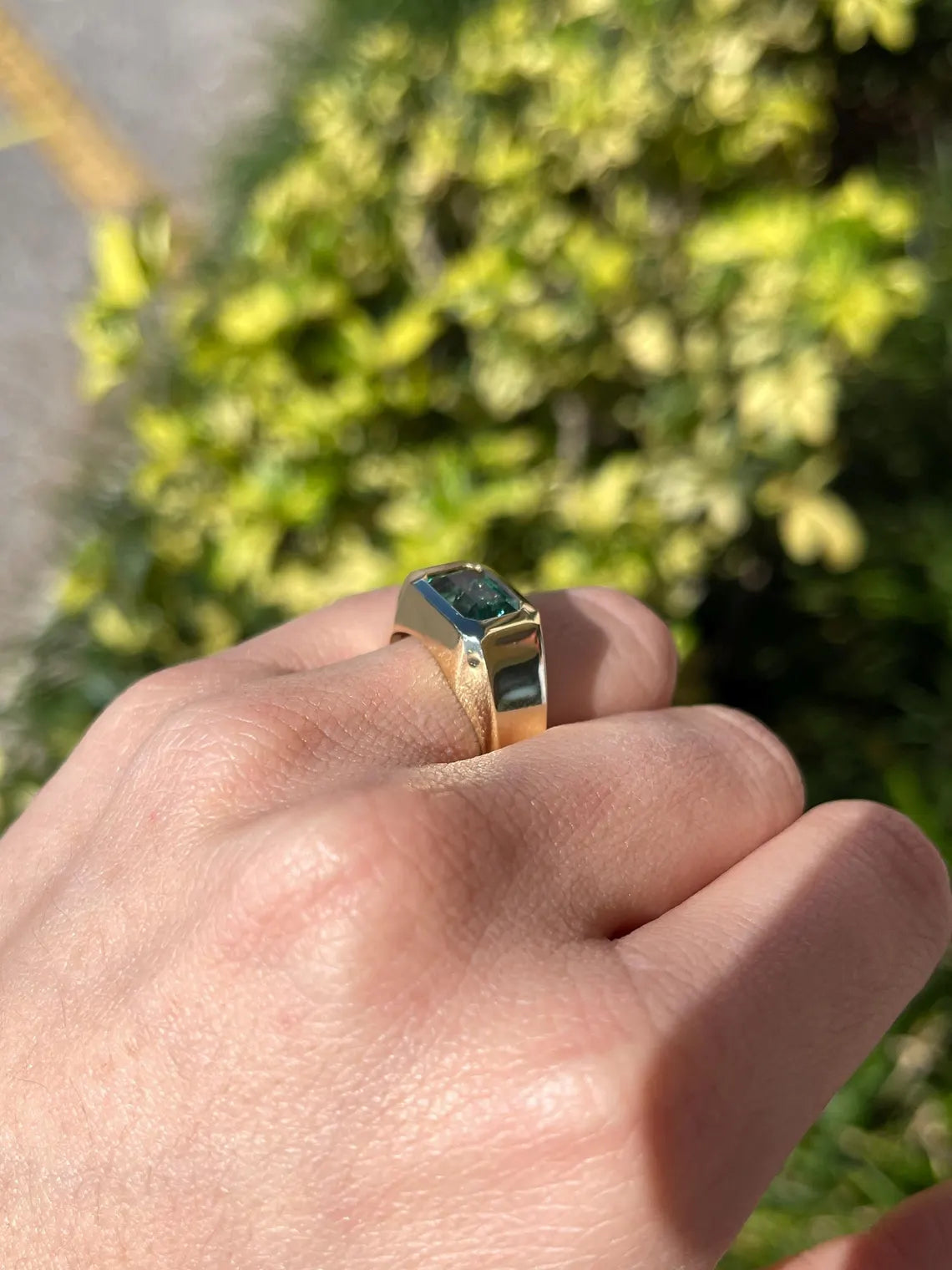 Men's ring featuring a 2.66 carat natural emerald cut emerald with bluish green hue, bezel set in a JR Colombian Emeralds design