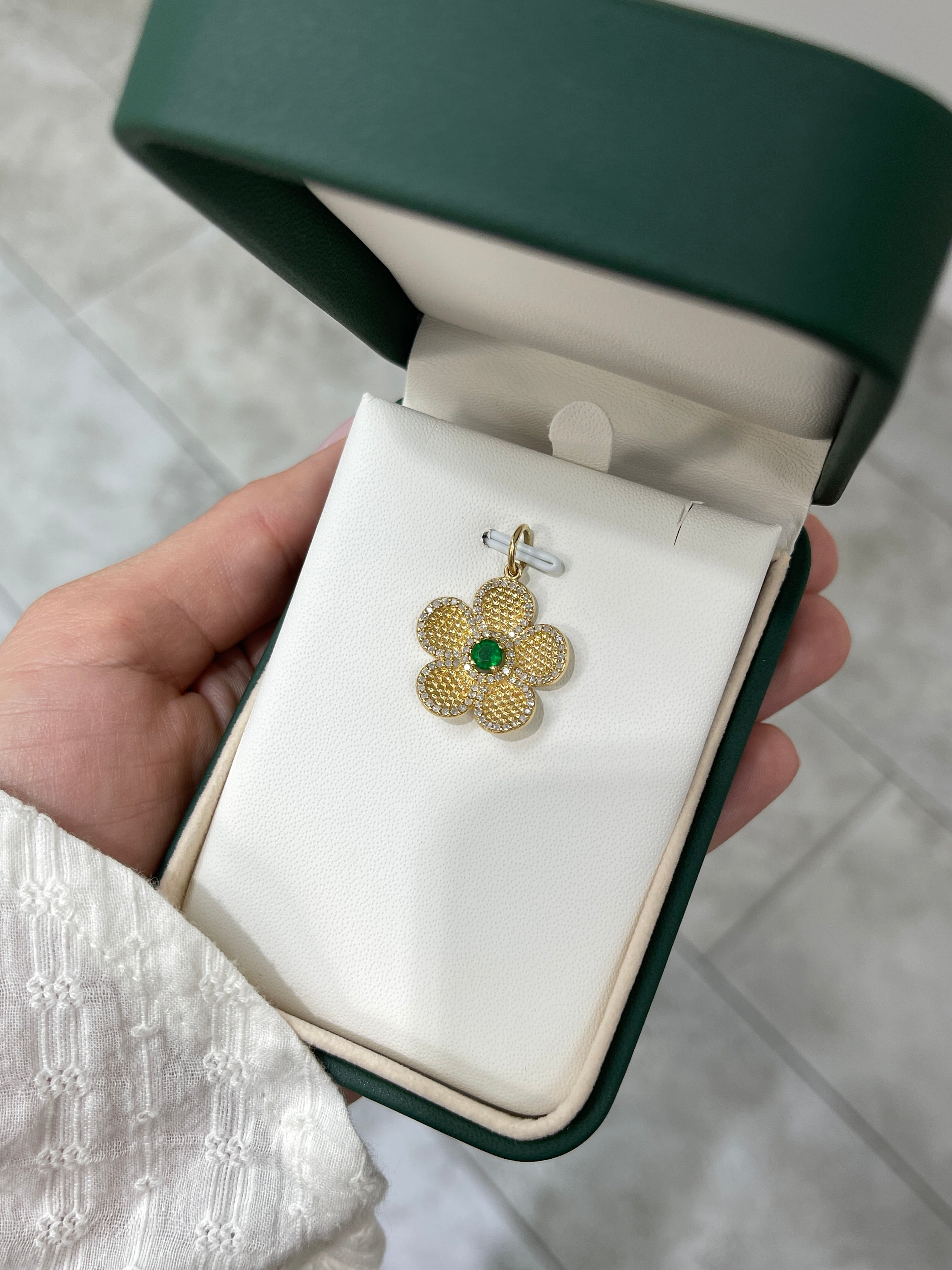 14K gold emerald and diamond flower pendant with 0.58tcw, featuring intricate design from JR Colombian Emeralds.
