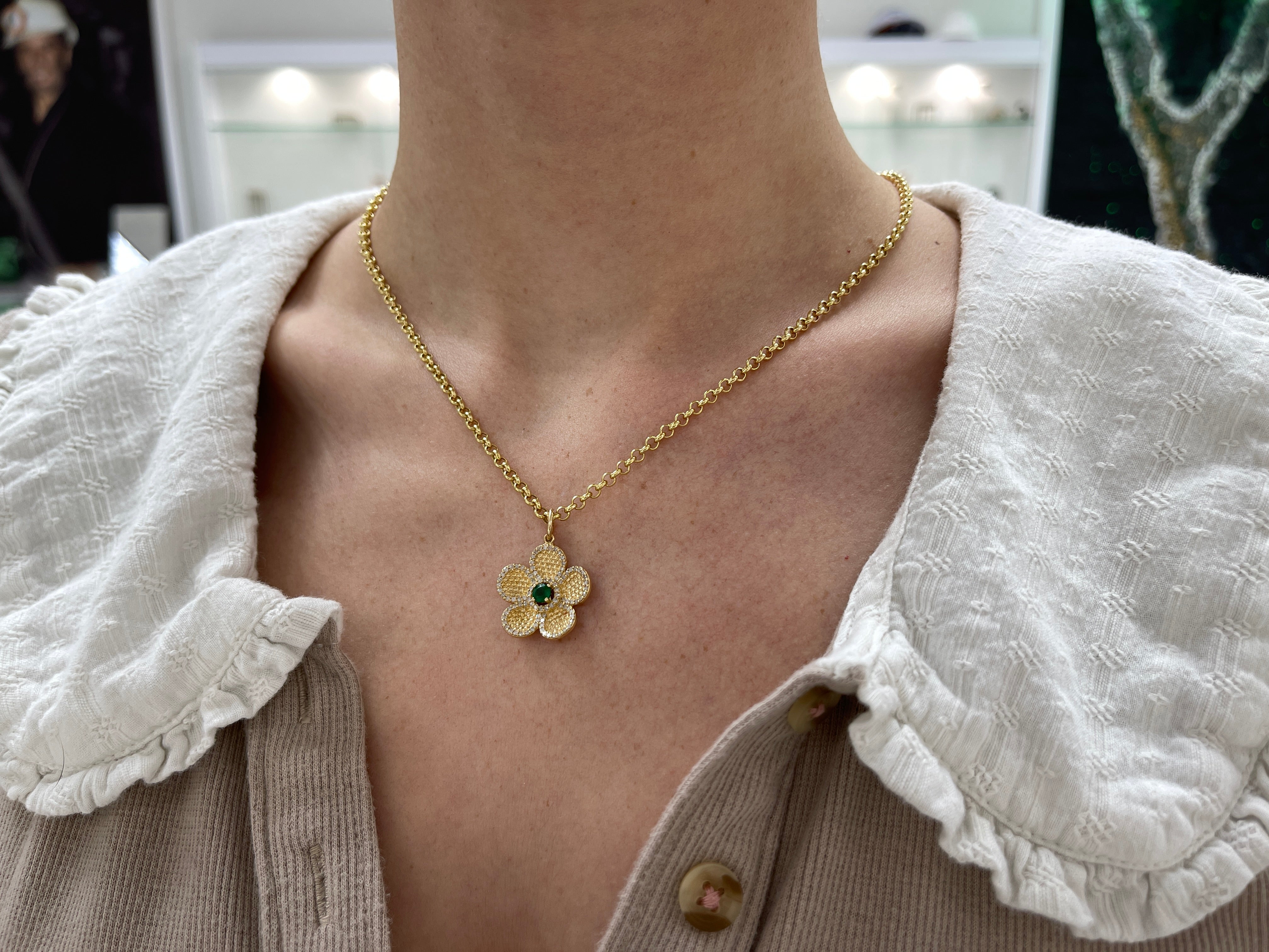 14K gold emerald and diamond flower pendant with 0.58 carats total weight, jewelry piece by JR Colombian Emeralds.